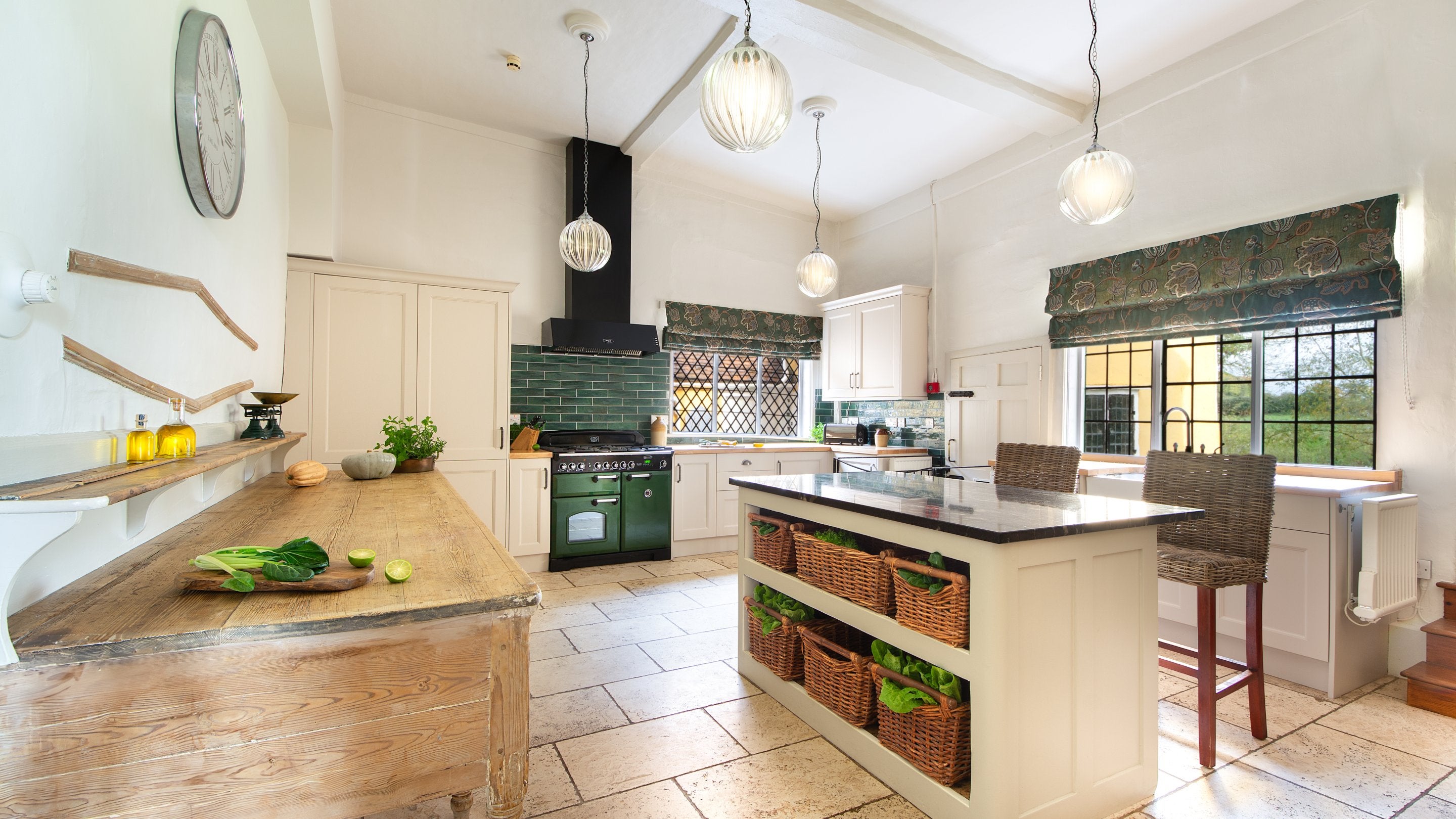 The kitchen at Thorington Hall, with a range cooker and kitchen island, Suffolk