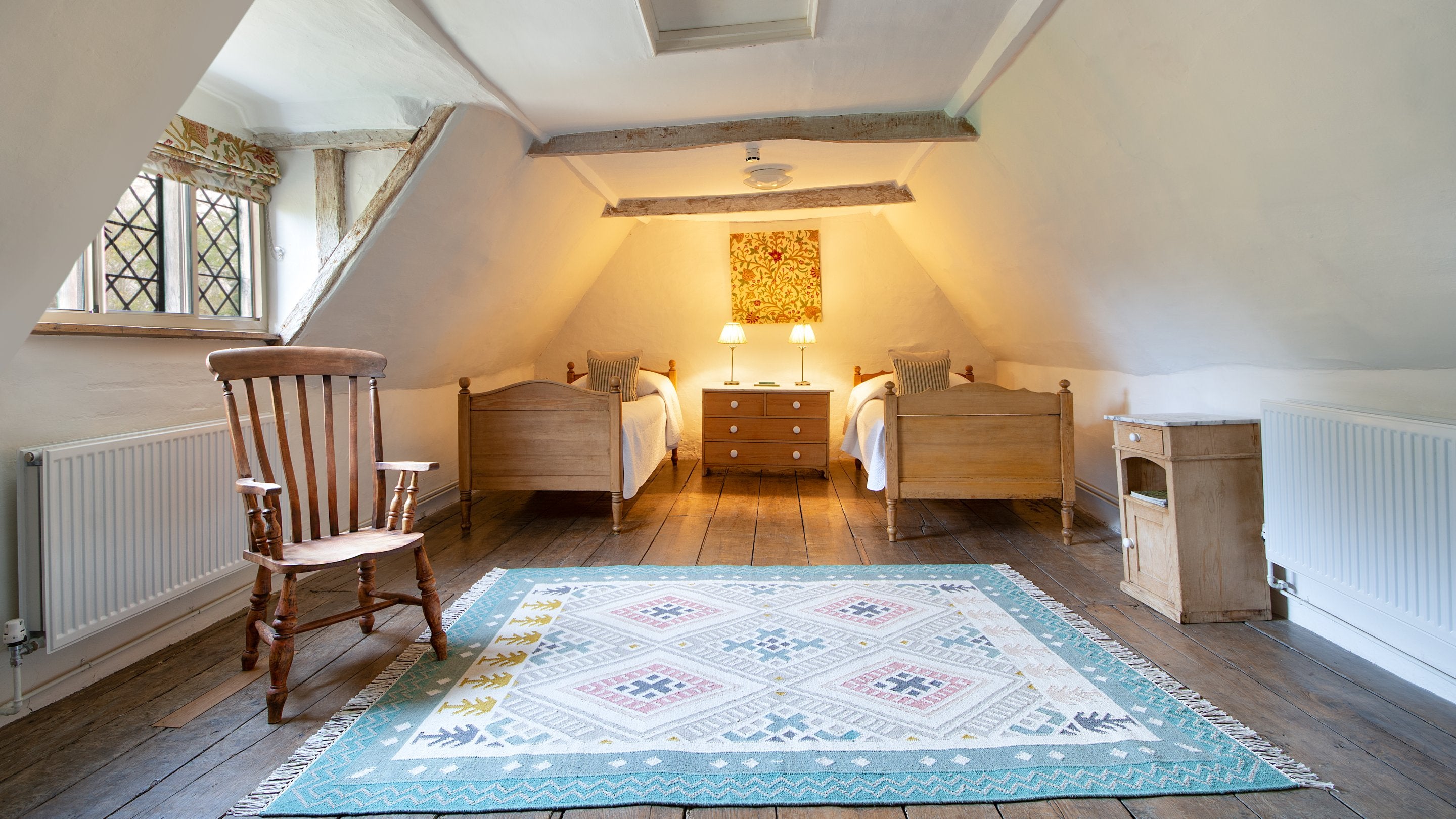 Bedroom 5 'Heigham,' with twin beds, on the second floor of Thorington Hall, Suffolk