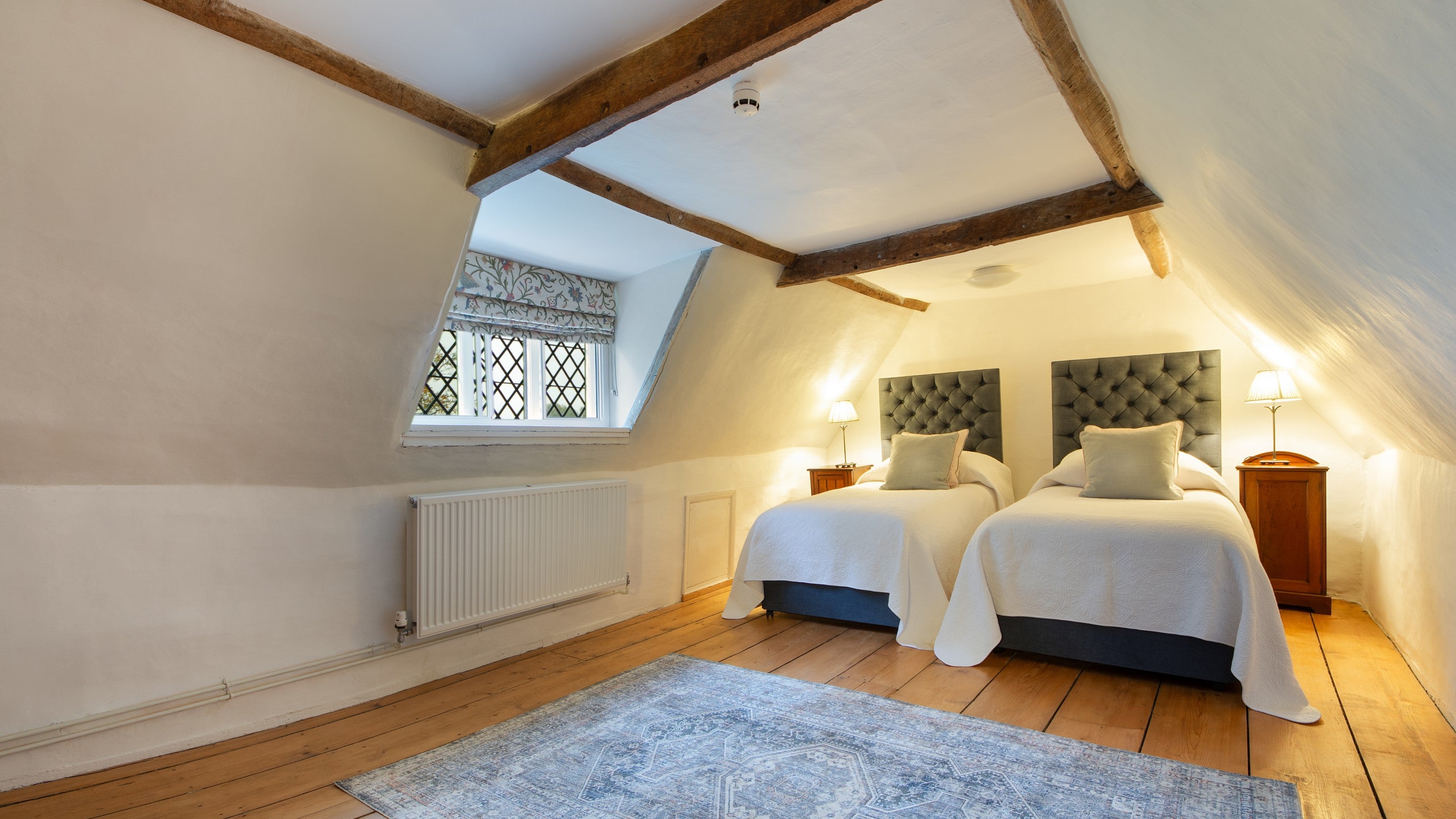Bedroom 6 'Wade,' with twin beds, on the second floor of Thorington Hall, Suffolk