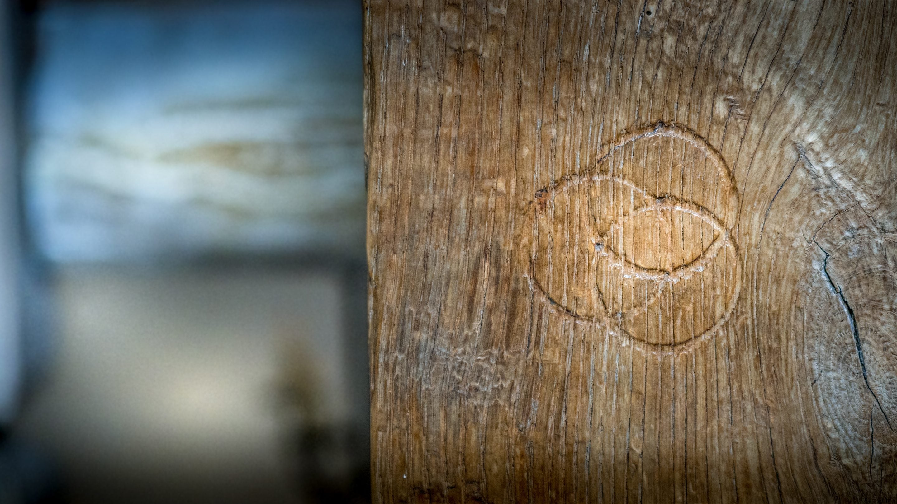 Witch marks carved into the west staircase at Thorington Hall, Suffolk