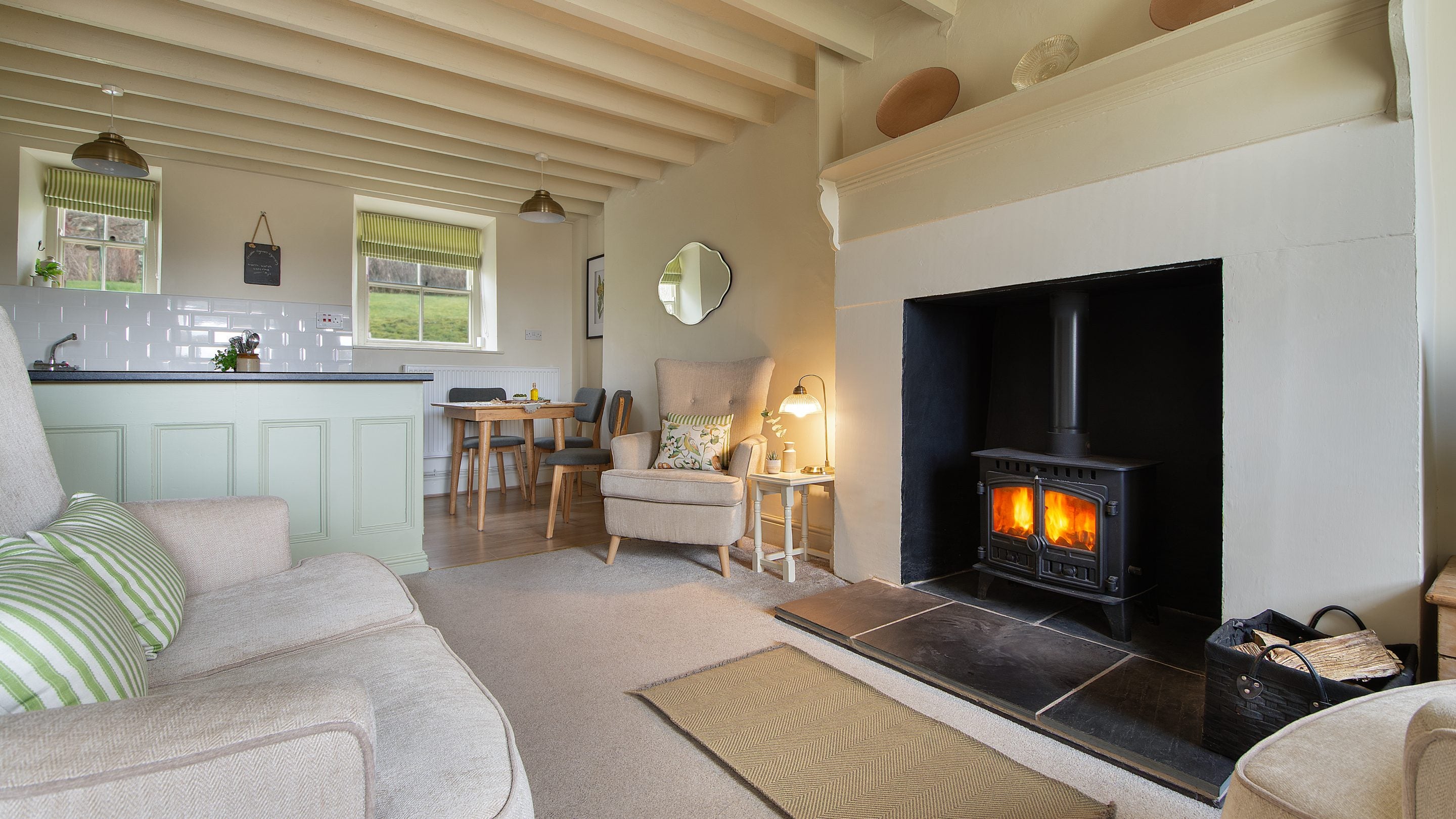 The open-plan room with sitting area and kitchen at 2 Siloam Cottage, Conwy