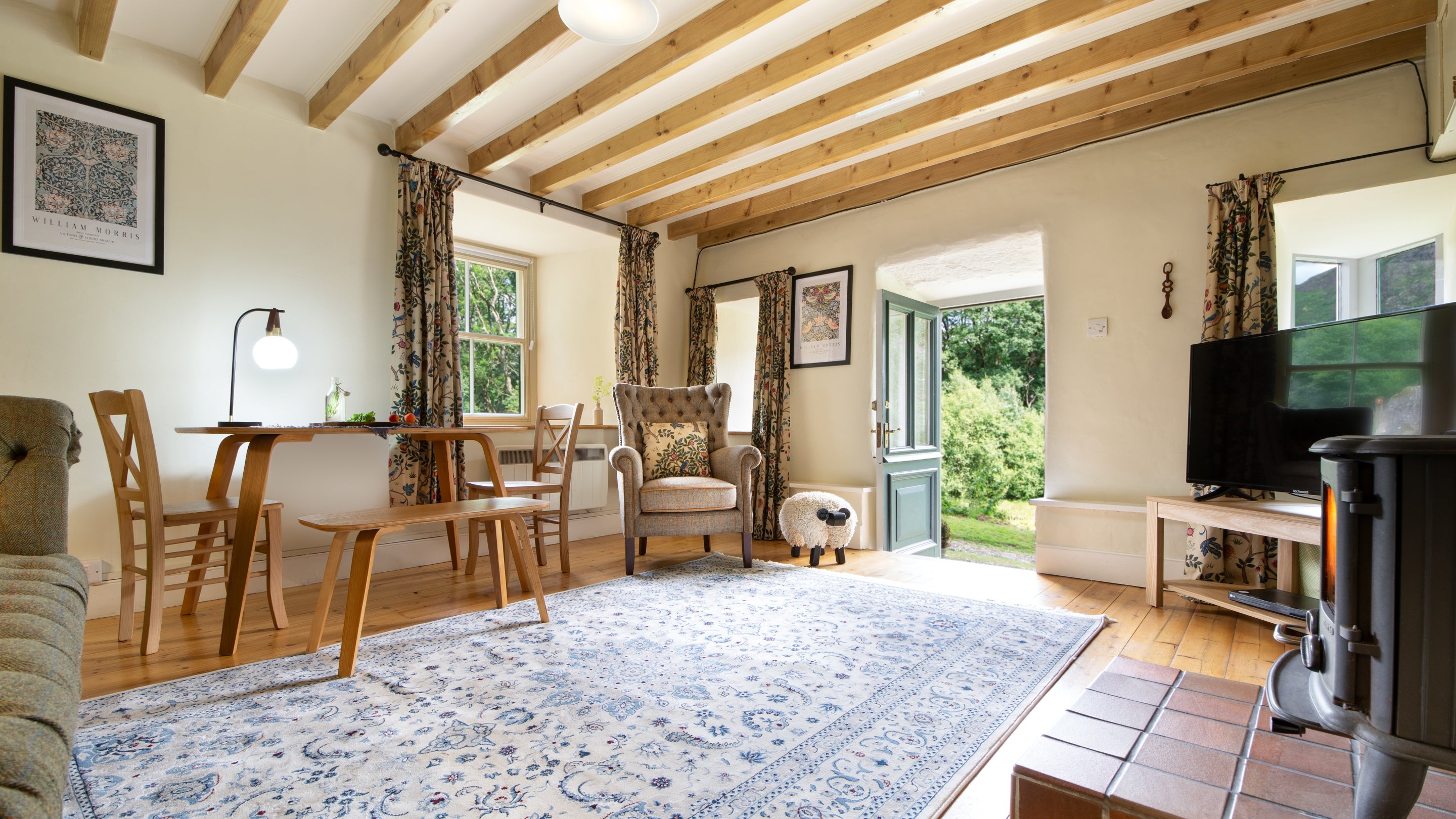 The open plan kitchen, sitting and dining room at Bwthyn Mai, Gwynedd