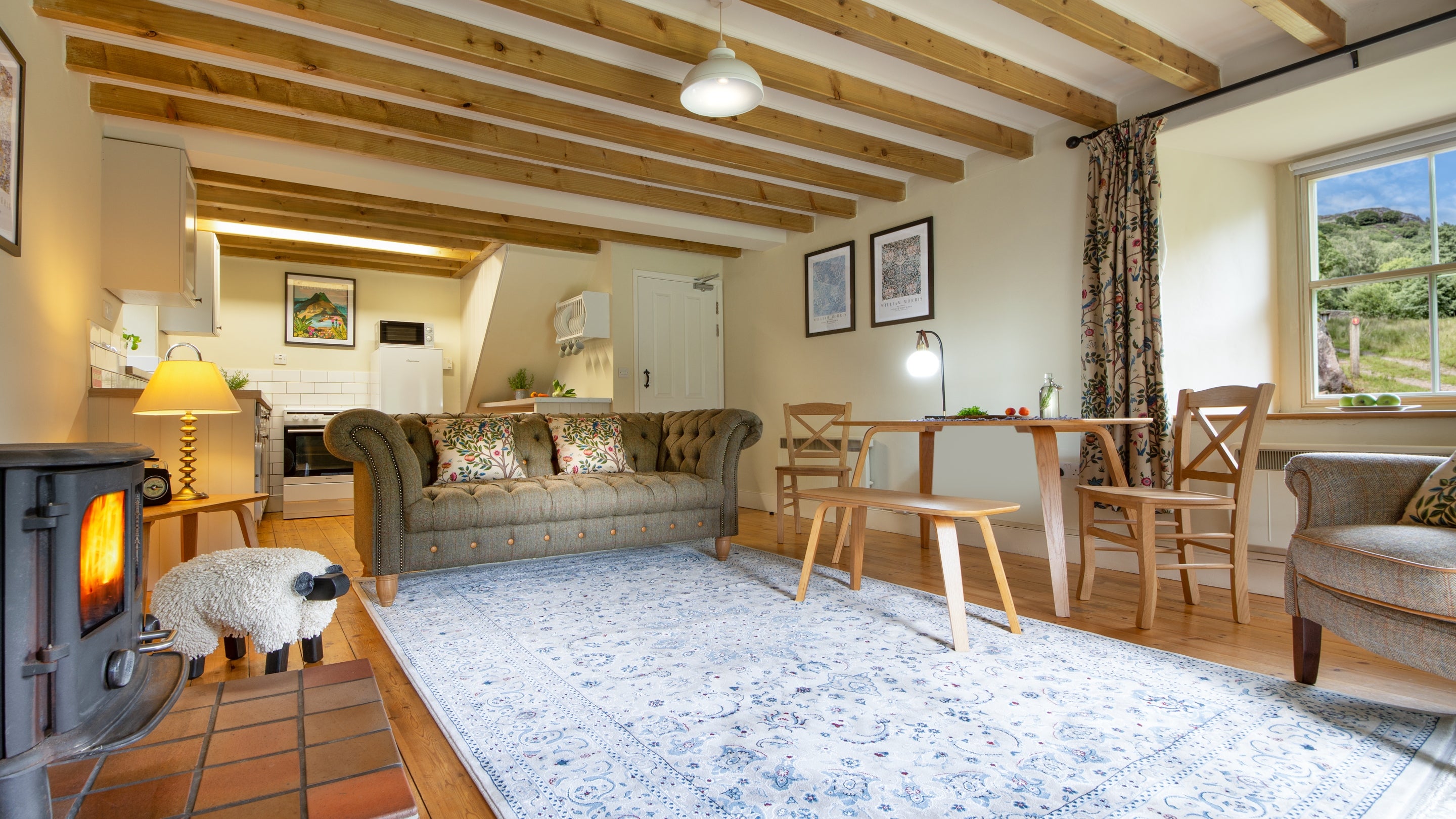 The open plan kitchen, sitting and dining room at Bwthyn Mai, Gwynedd