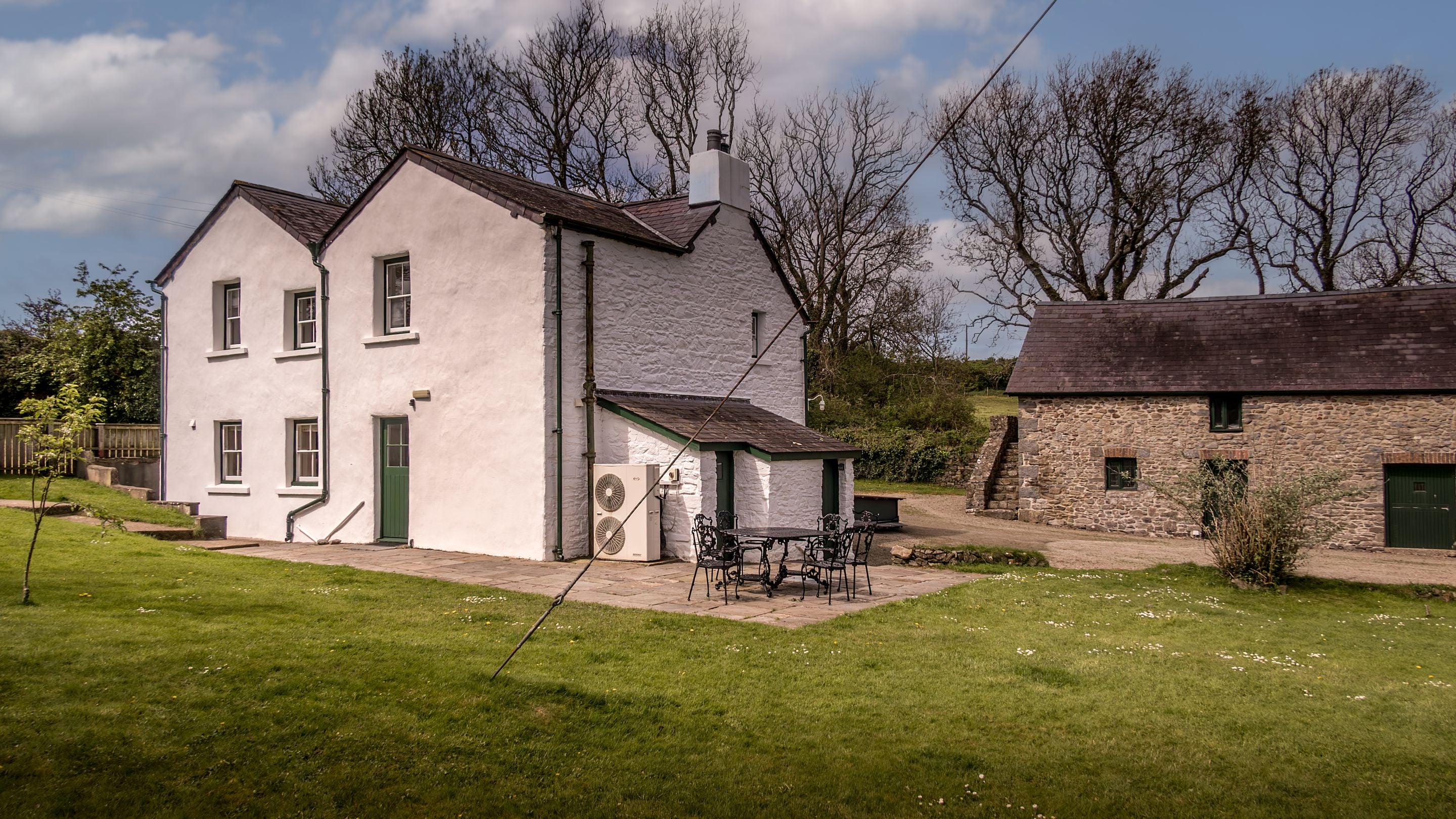 The garden at Caerllan, with lawn and patio, Ceredigion