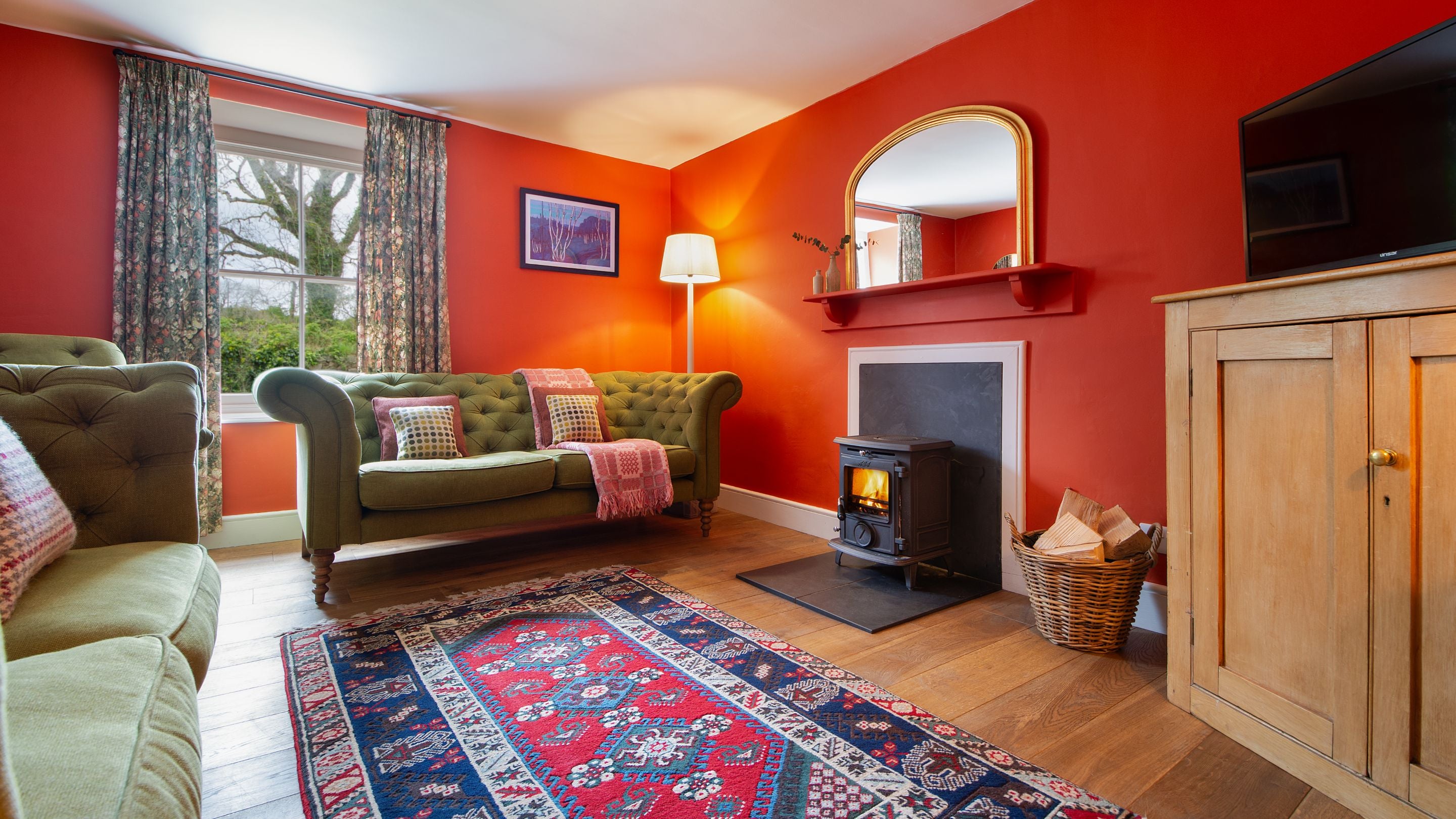 The sitting room with woodburner at Caerllan, Ceredigion