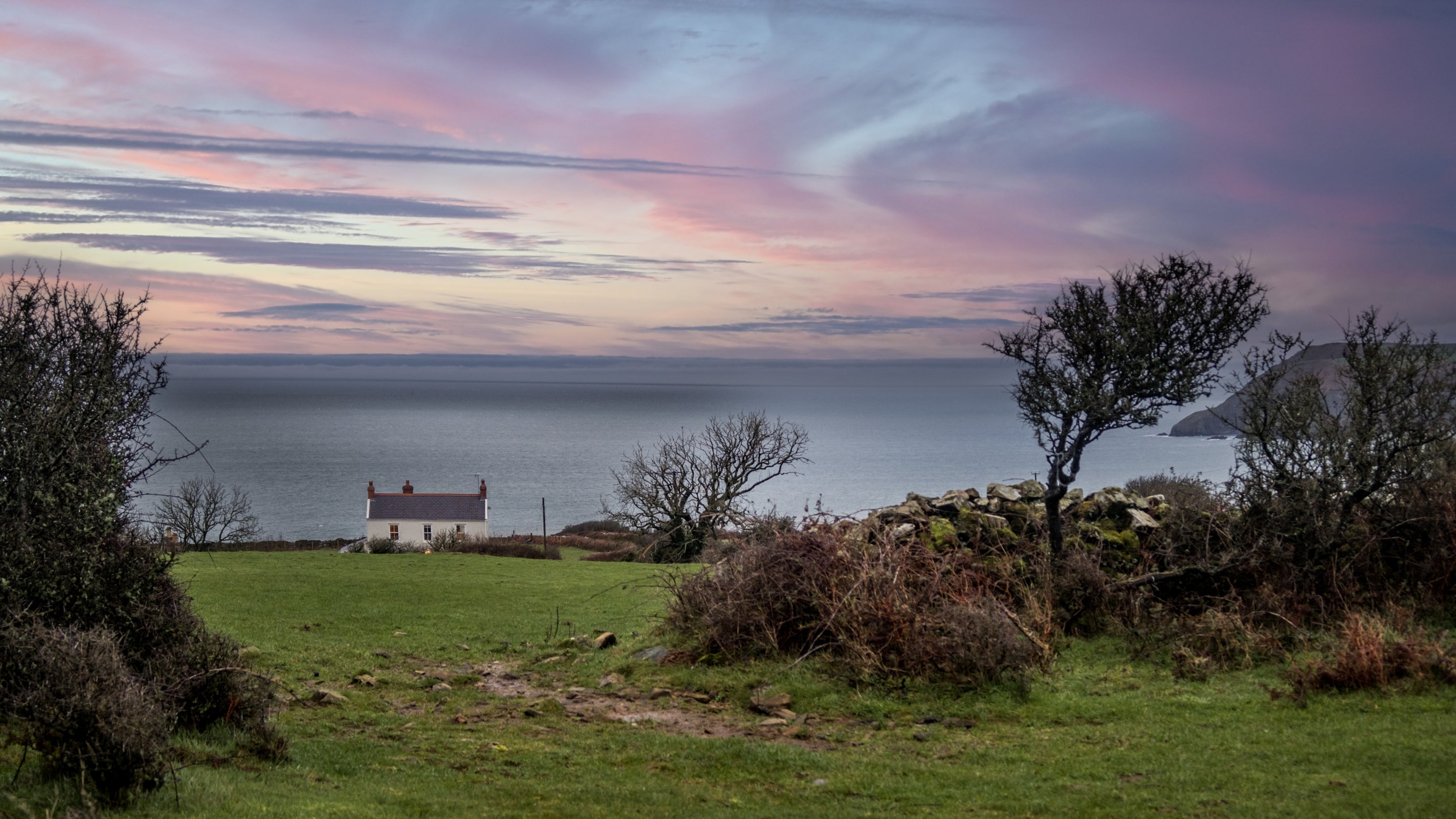 The exterior of Castell Farmhouse and the surrounding area, Pembrokeshire