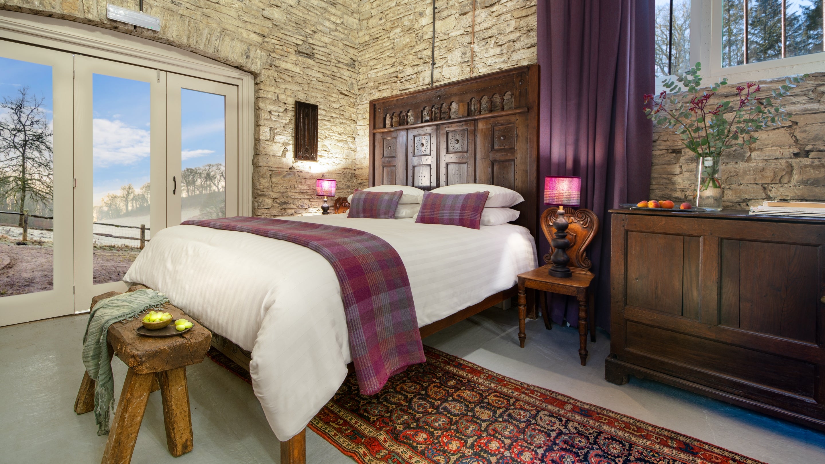 The bed within the open-plan living room at Dinefwr Deer Lodge, Carmarthenshire