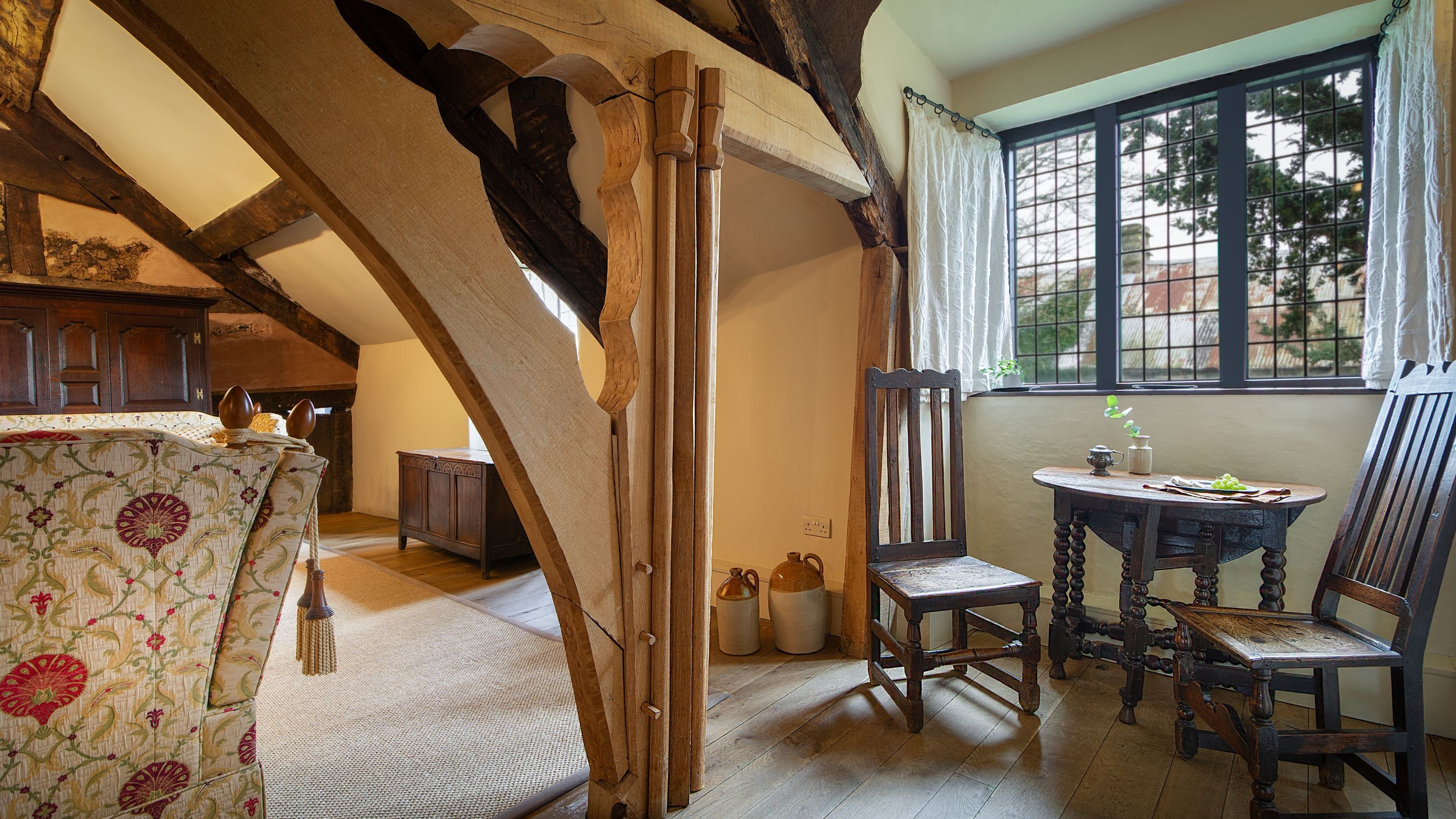 The small dining table for two in the medieval hall sitting room at Egryn, Gwynedd