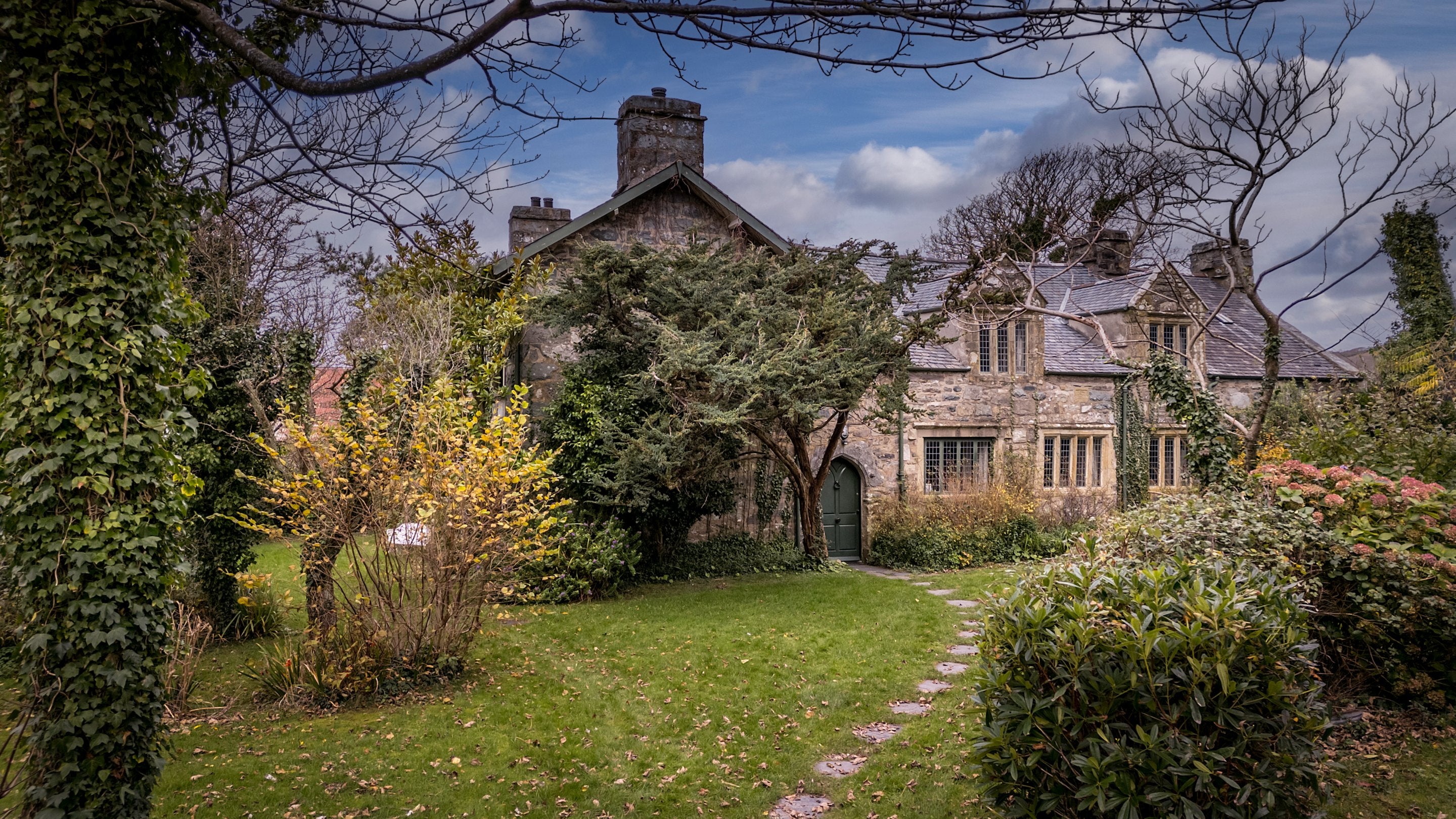 A large private garden with mature trees surrounds Egryn, Wales