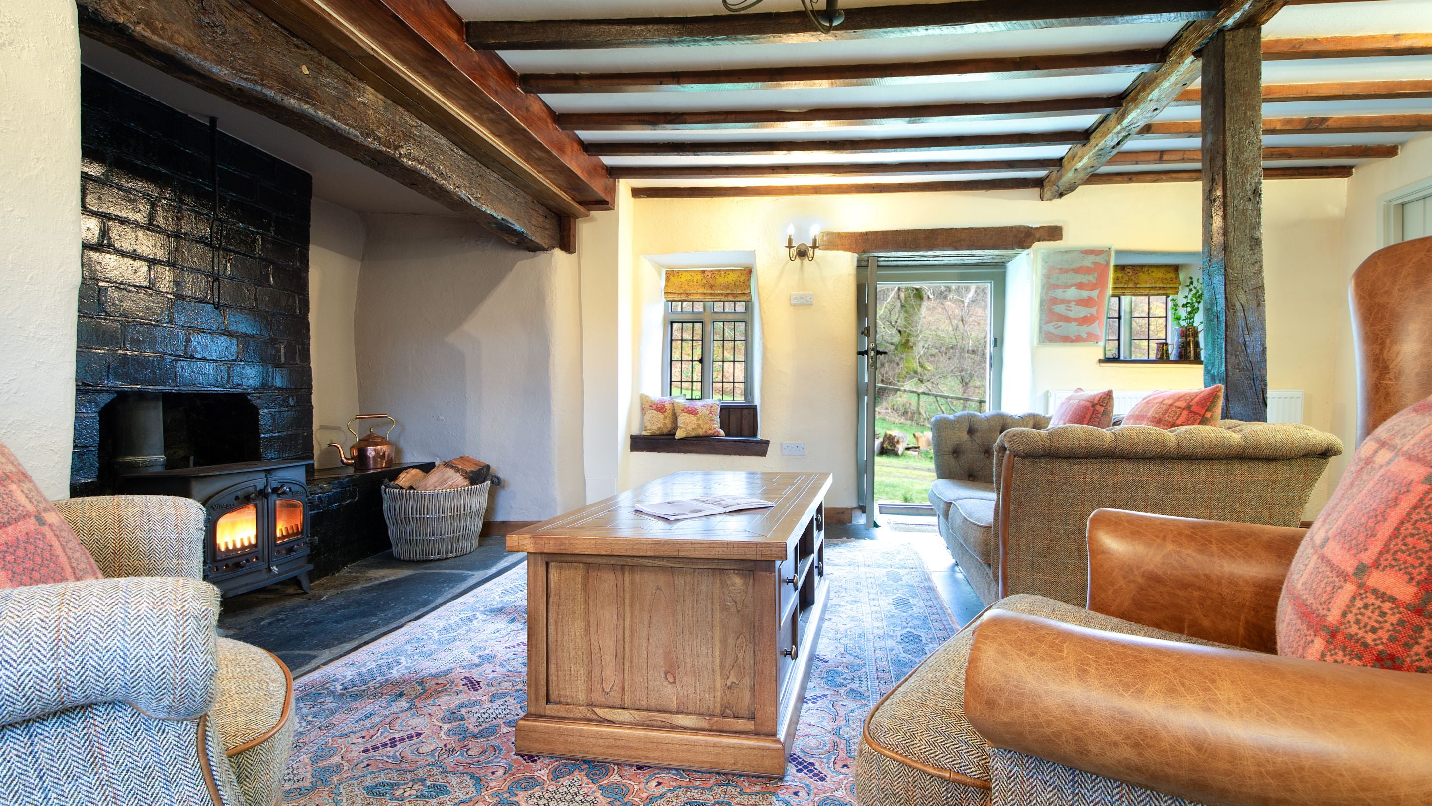 The sitting room with woodburner at Fron Dirion, Powys