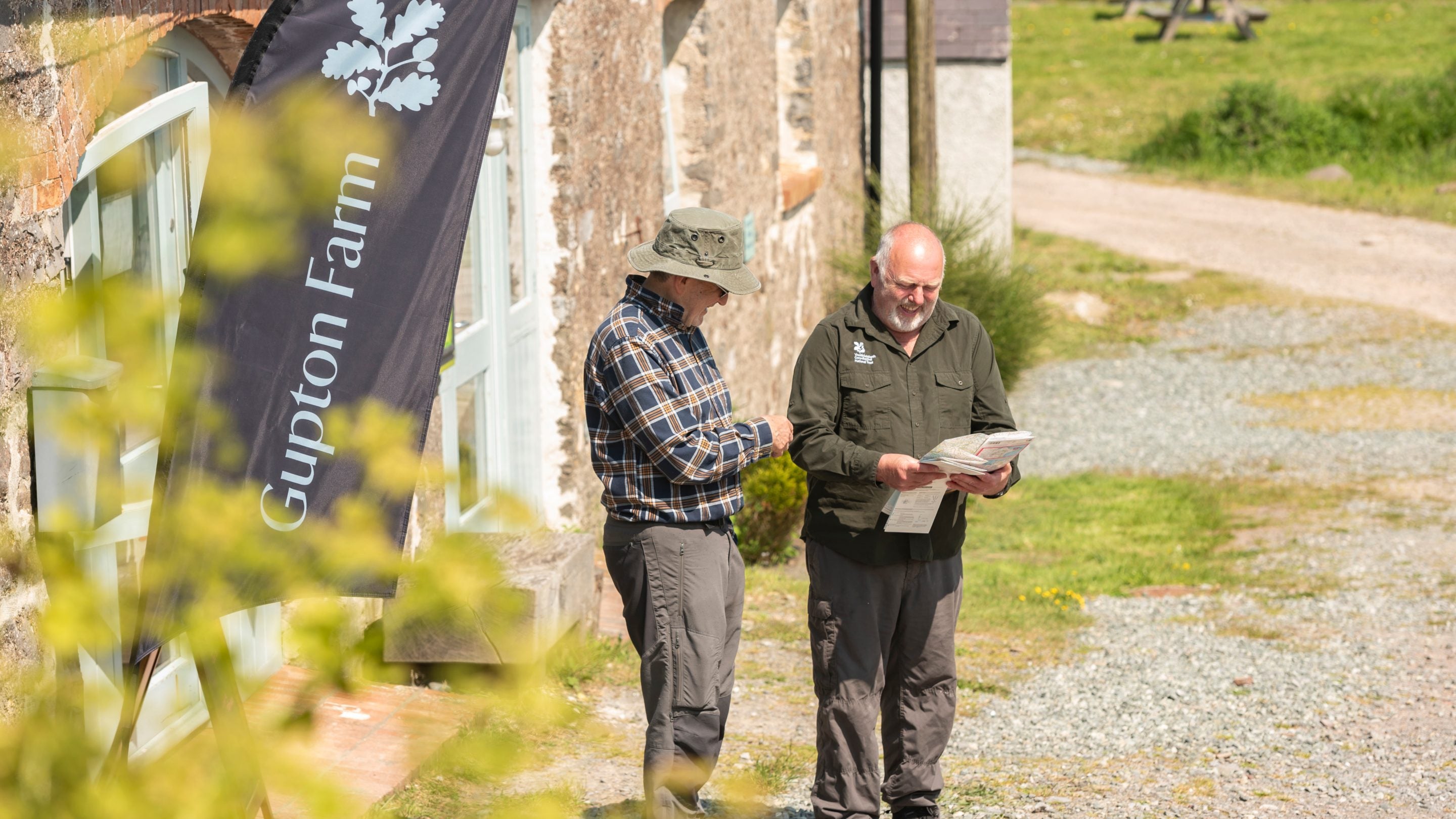 Chatting outside reception at Gupton Farm Campsite, Pembrokeshire