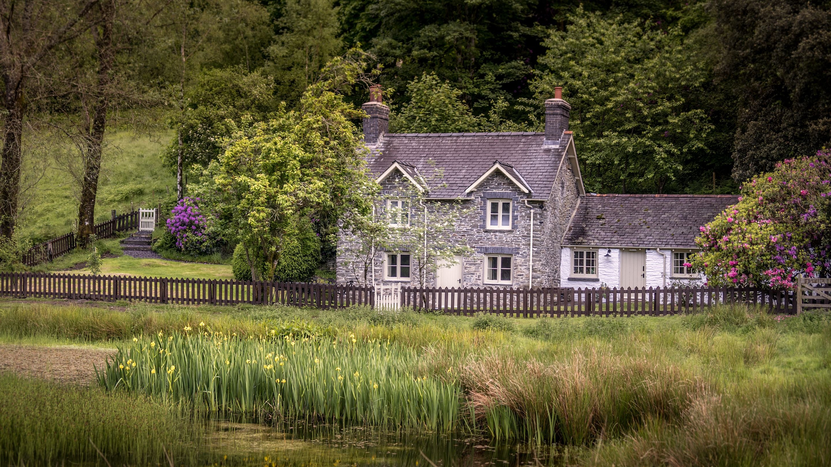 A view of Hawthorn Cottage from across the old duckpond on the Hafod Estate, Ceredigion