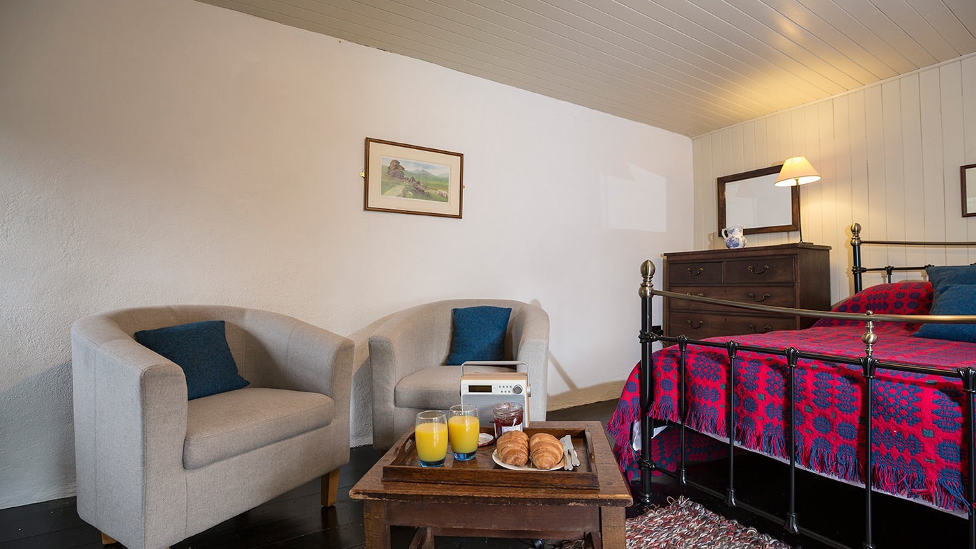 The double bedroom accessed by an external stone staircase at Hen Dy, Gwynedd, Gwynedd