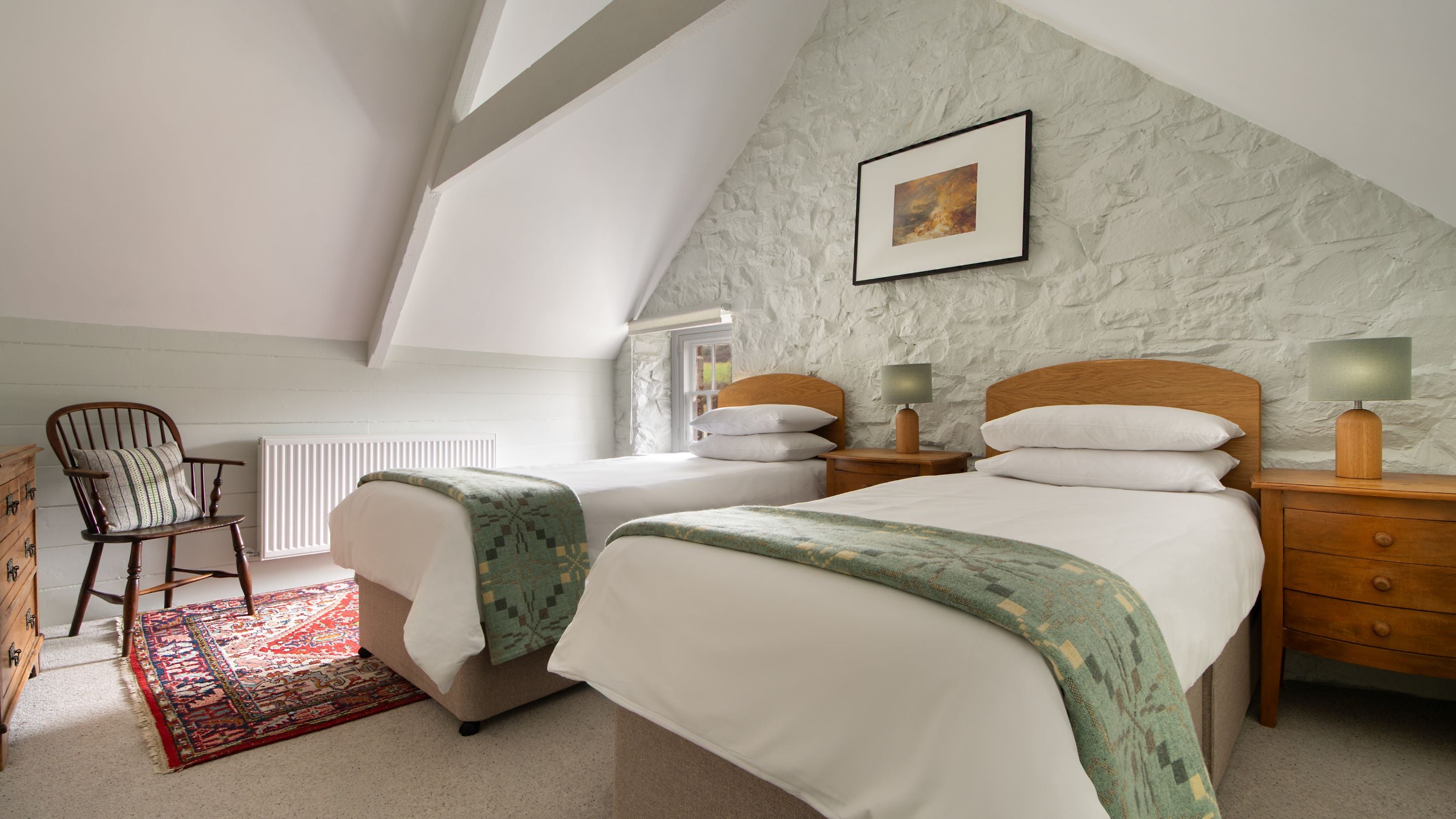One of the second-floor twin bedrooms at Llanborth Farmhouse, Ceredigion