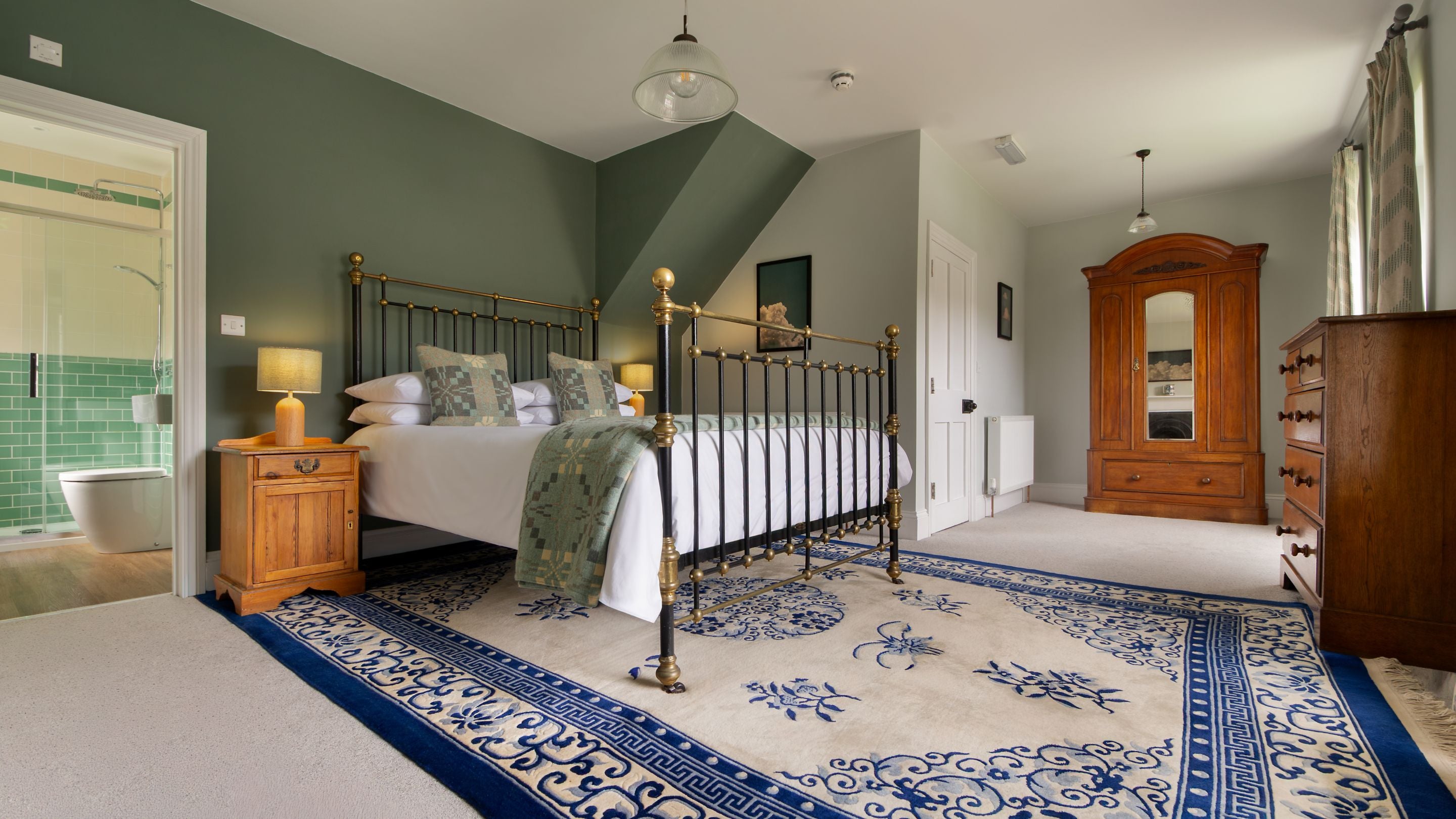 The king-size bedroom with en-suite shower room at Llanborth Farmhouse, Ceredigion