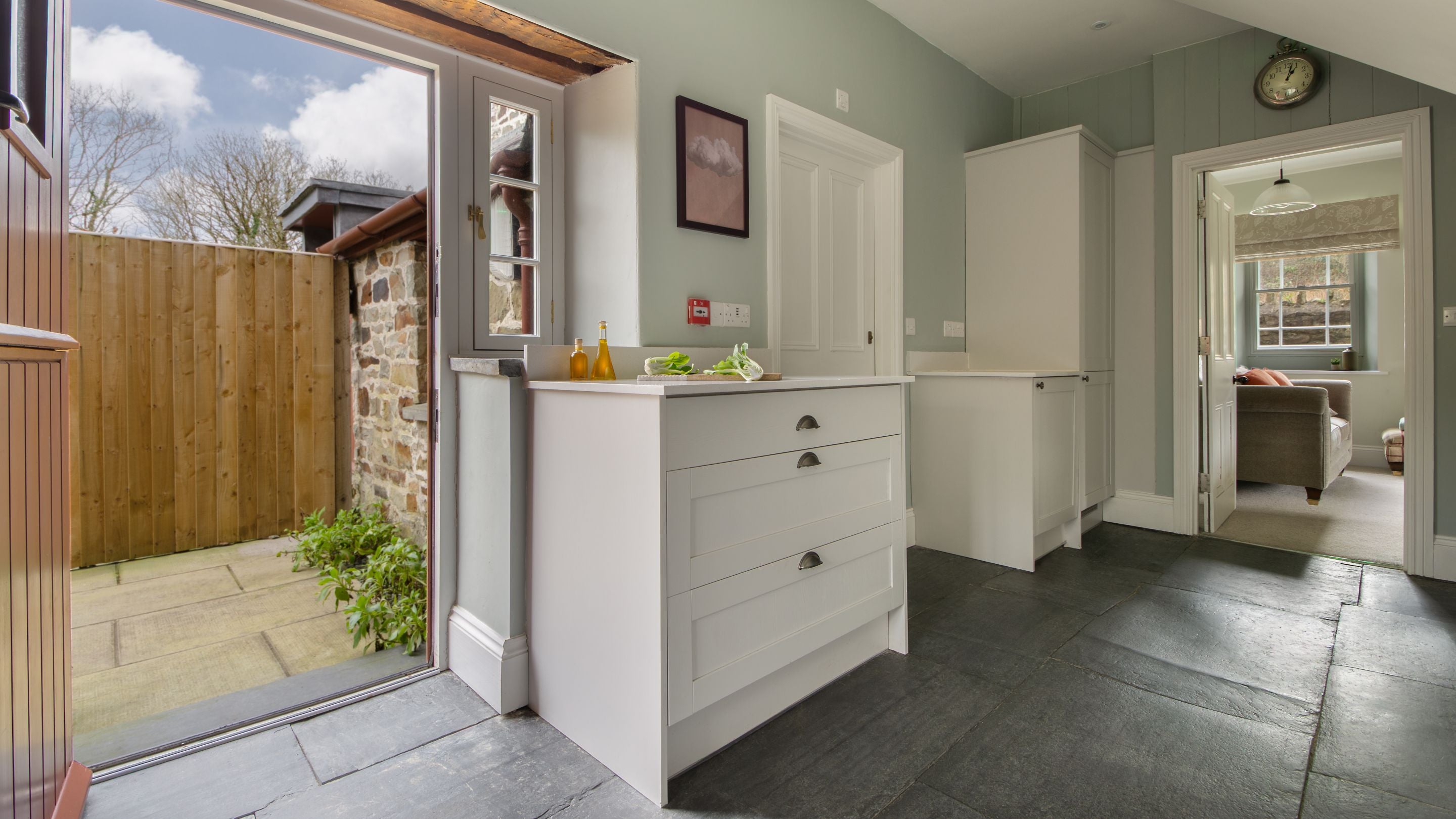 The kitchen leading outside to the patio area at Llanborth Farmhouse, Ceredigion