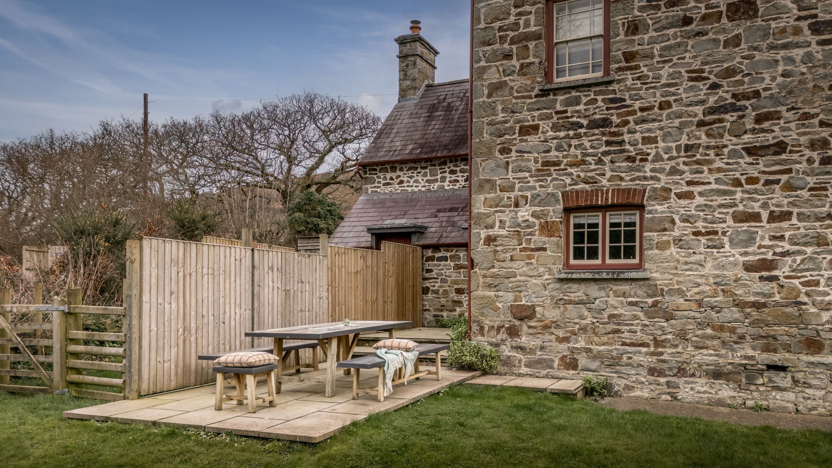 The paved patio area in the garden at Llanborth Farmhouse, Ceredigion