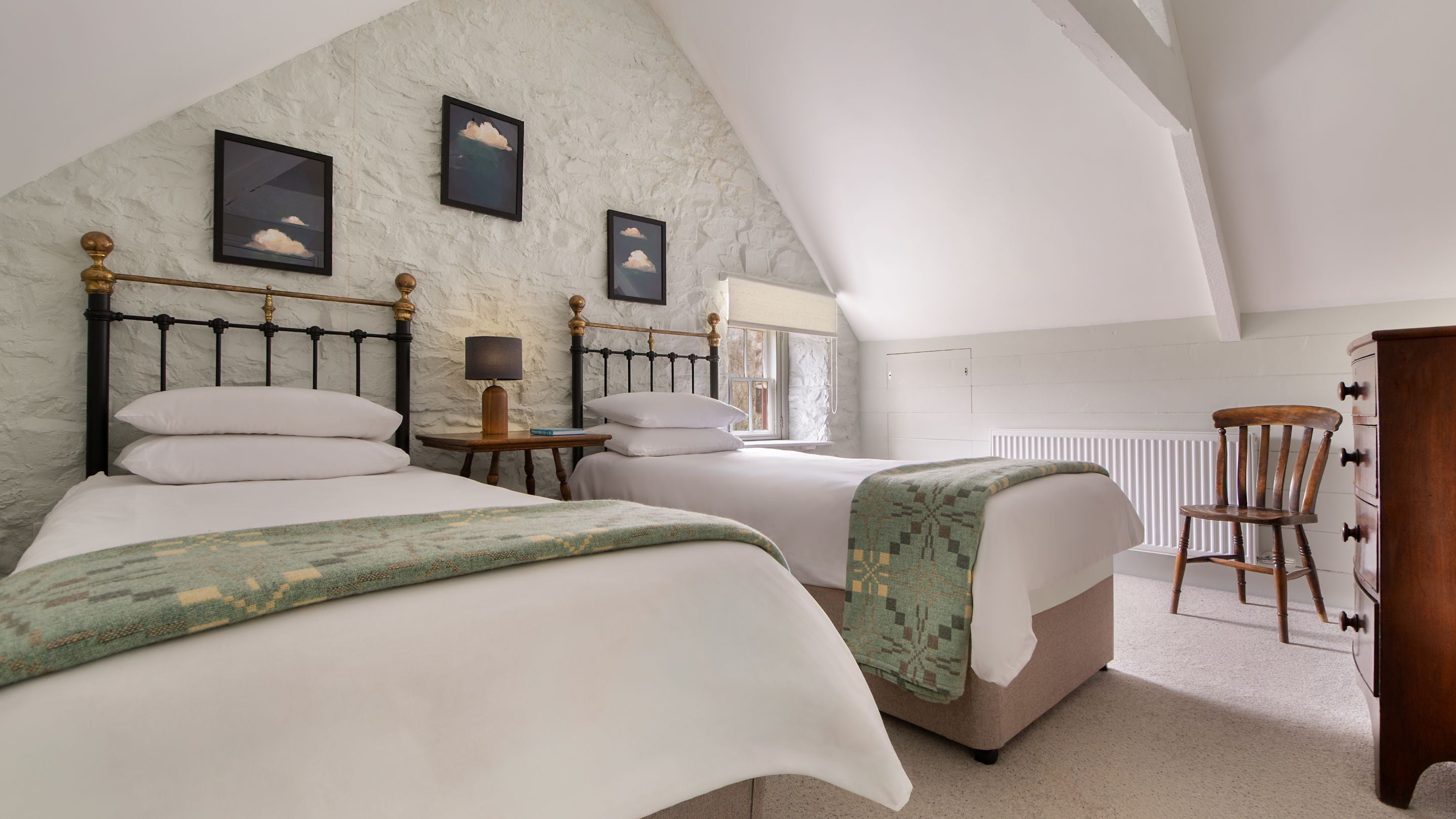 One of the second-floor twin bedrooms at Llanborth Farmhouse, Ceredigion