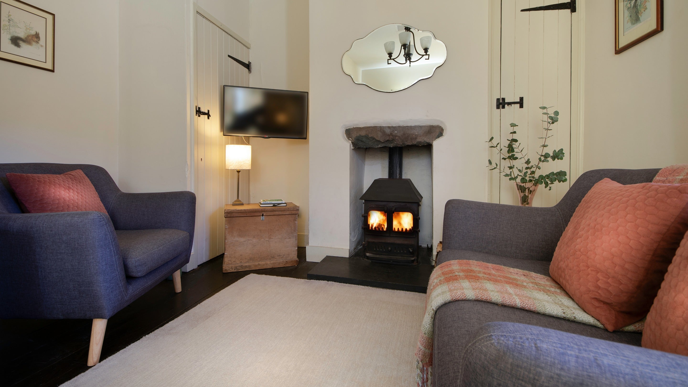 The sitting room with comfortable places to sit by the woodburning stove, Nant Las, Gwynedd