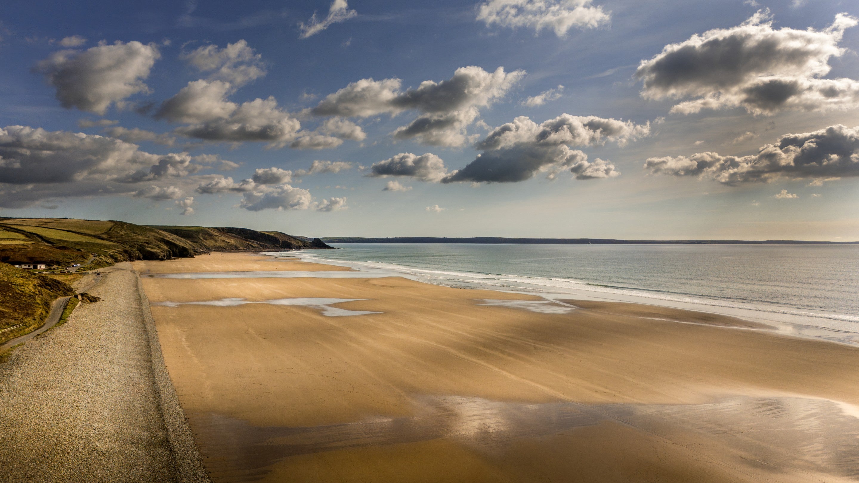 An aerial view of Newgale Beach, two miles of golden sand with pebble bank, Pembrokeshire