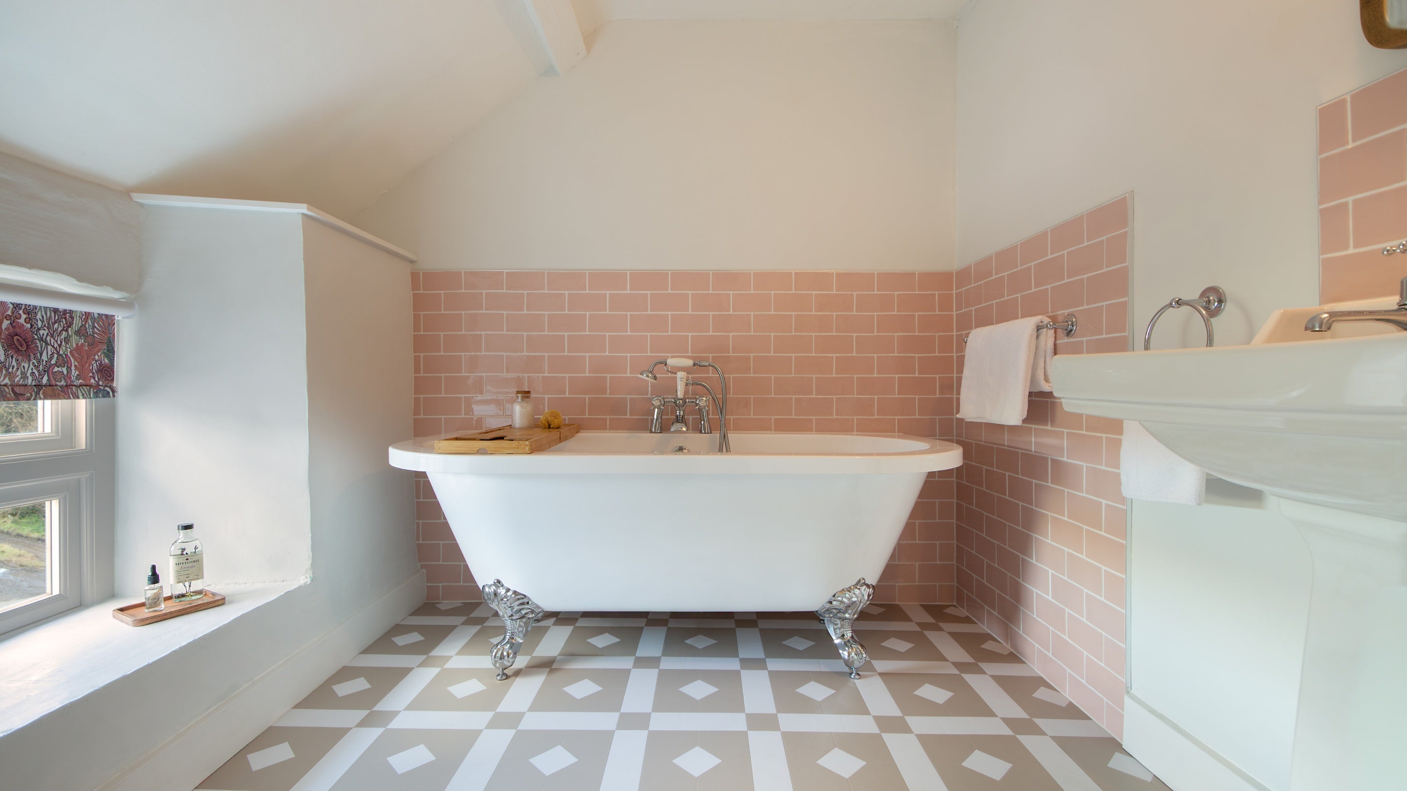 The family bathroom at Newgale Wood Farm, with bath with handheld shower attachment, Pembrokeshire