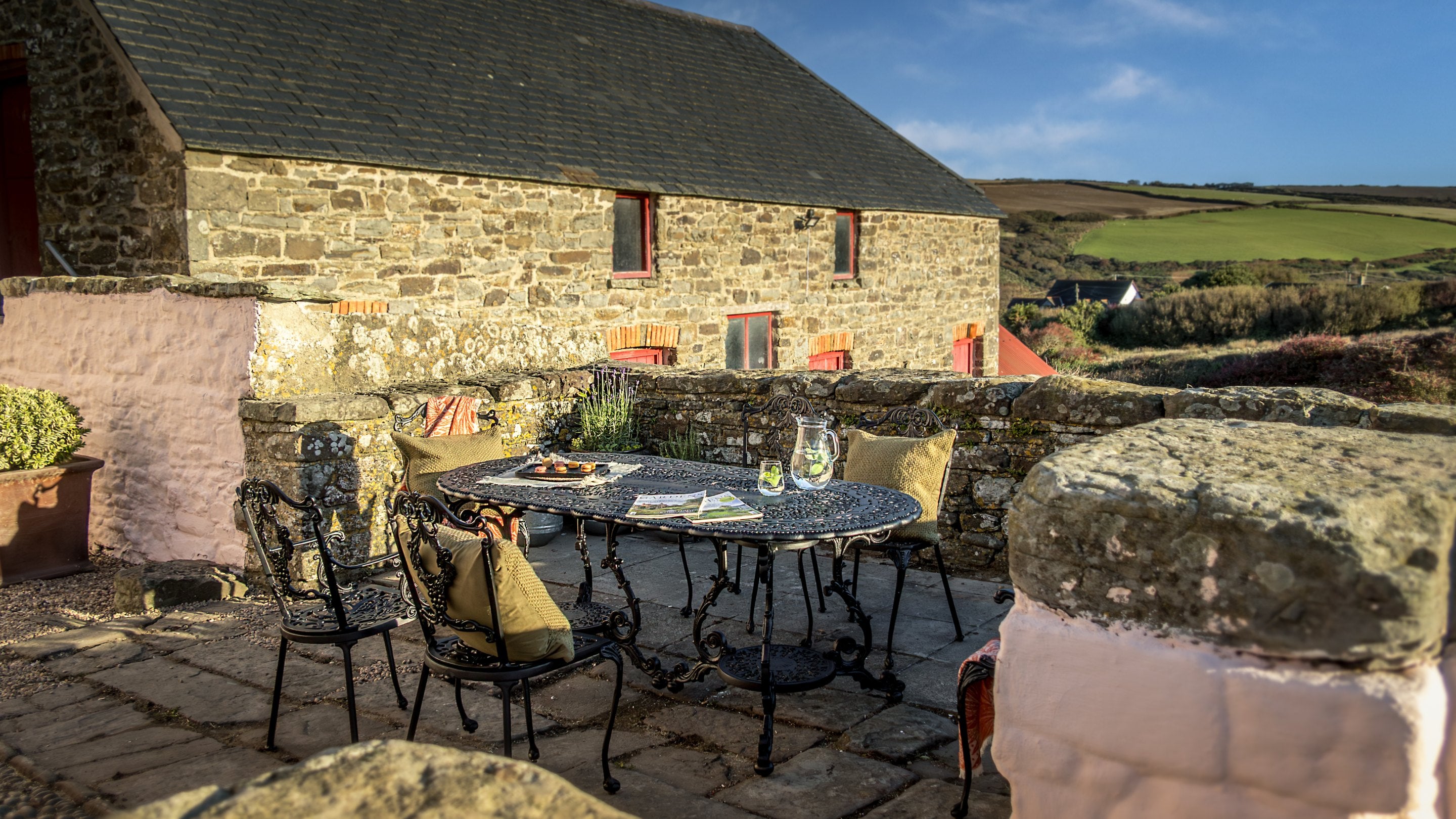 The outdoor dining area in Newgale Wood Farm's courtyard, Pembrokeshire