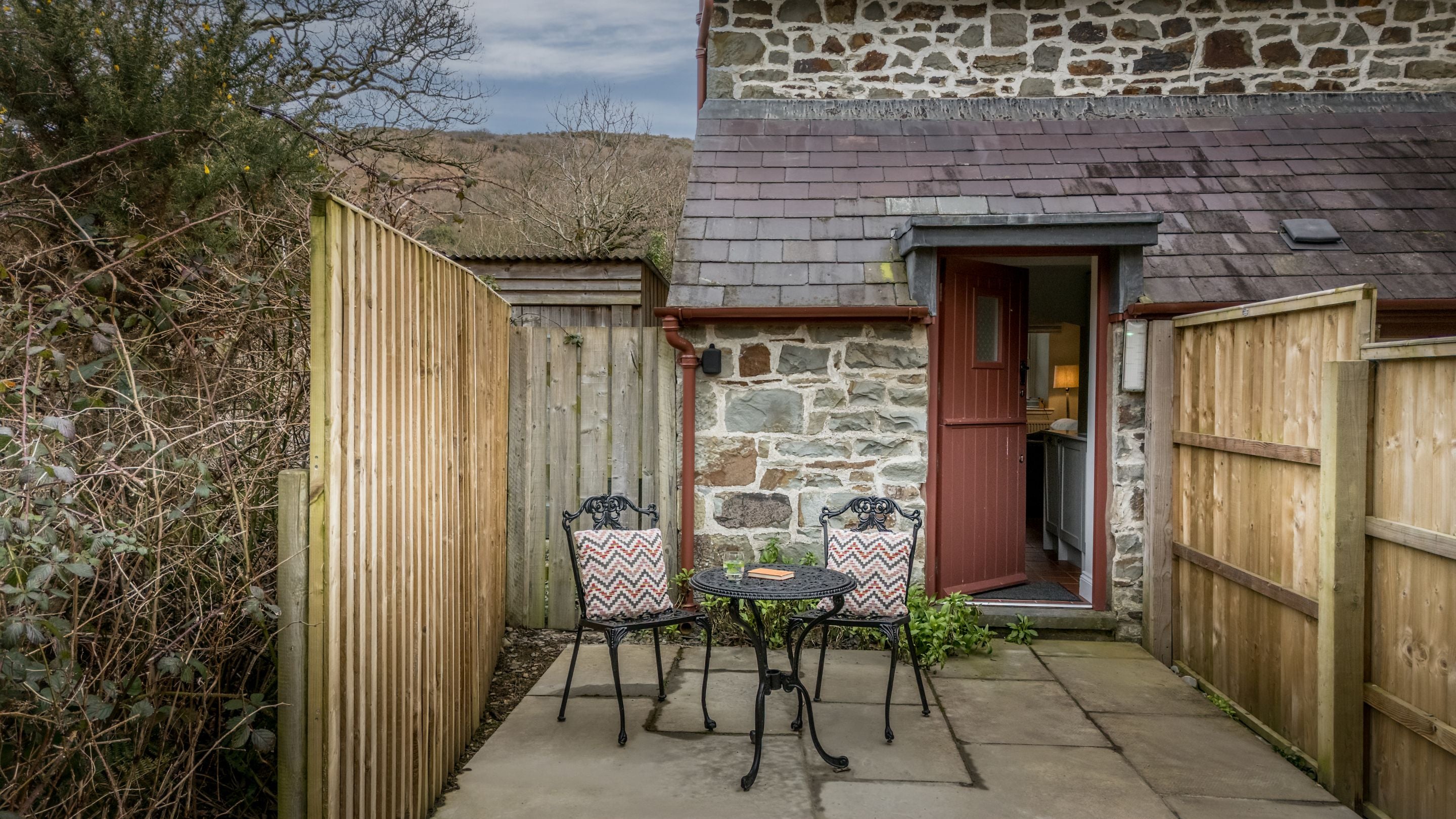 The back door and patio area at Penbryn Cottage, Ceredigion