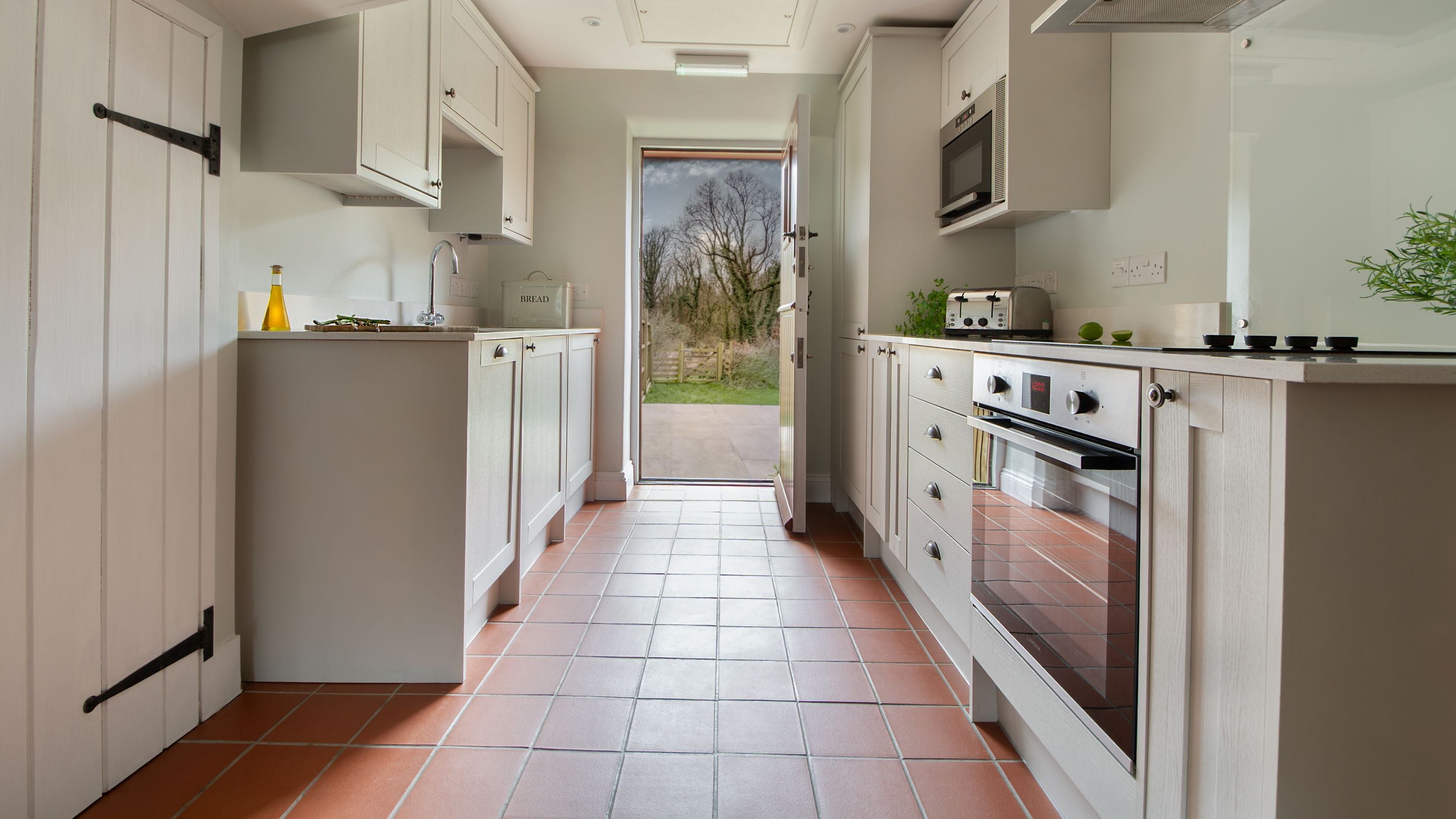 The kitchen area in the open-plan living space at Penbryn Cottage, Ceredigion