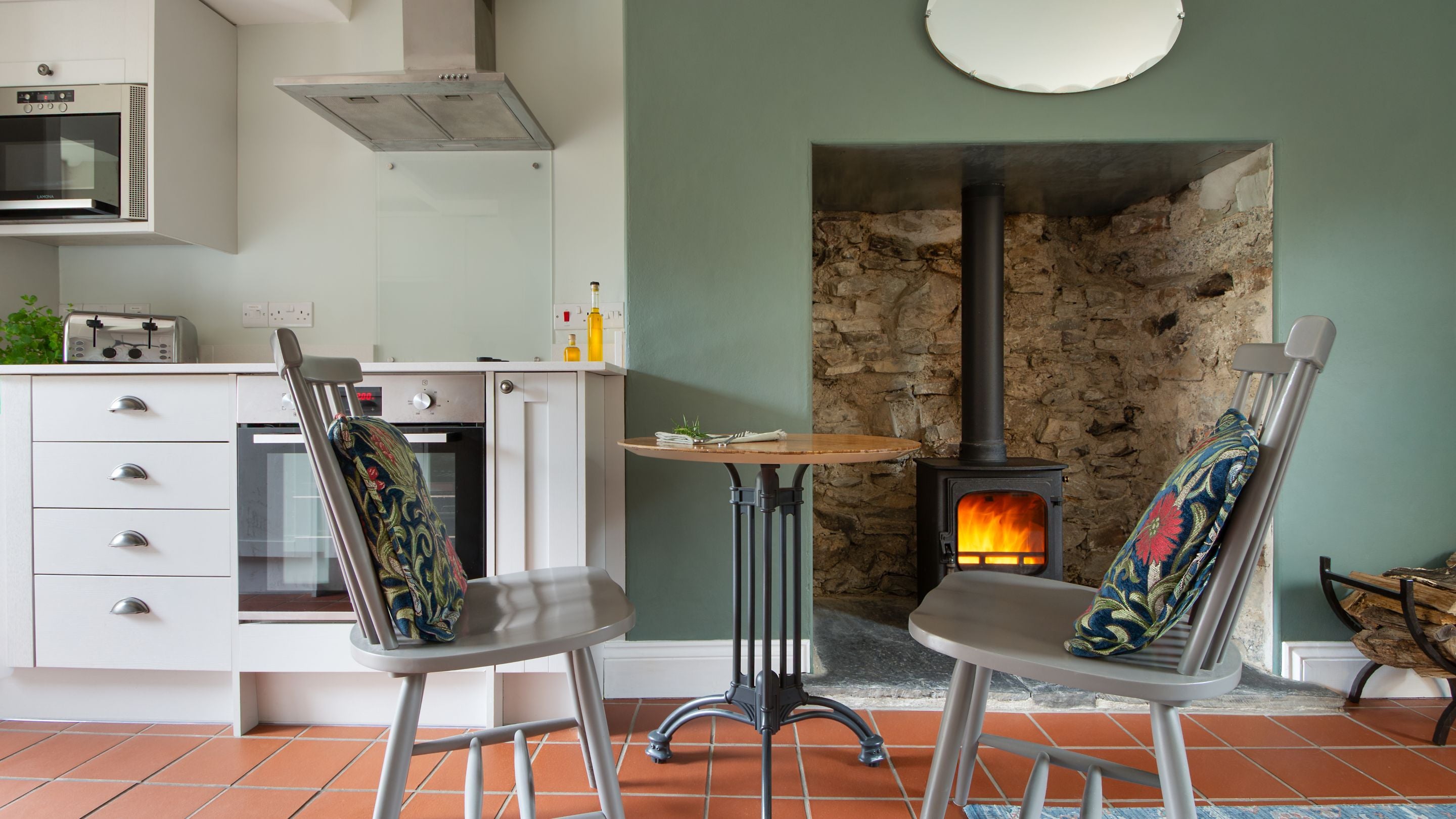The table for two in the open-plan living space at Penbryn Cottage, Ceredigion
