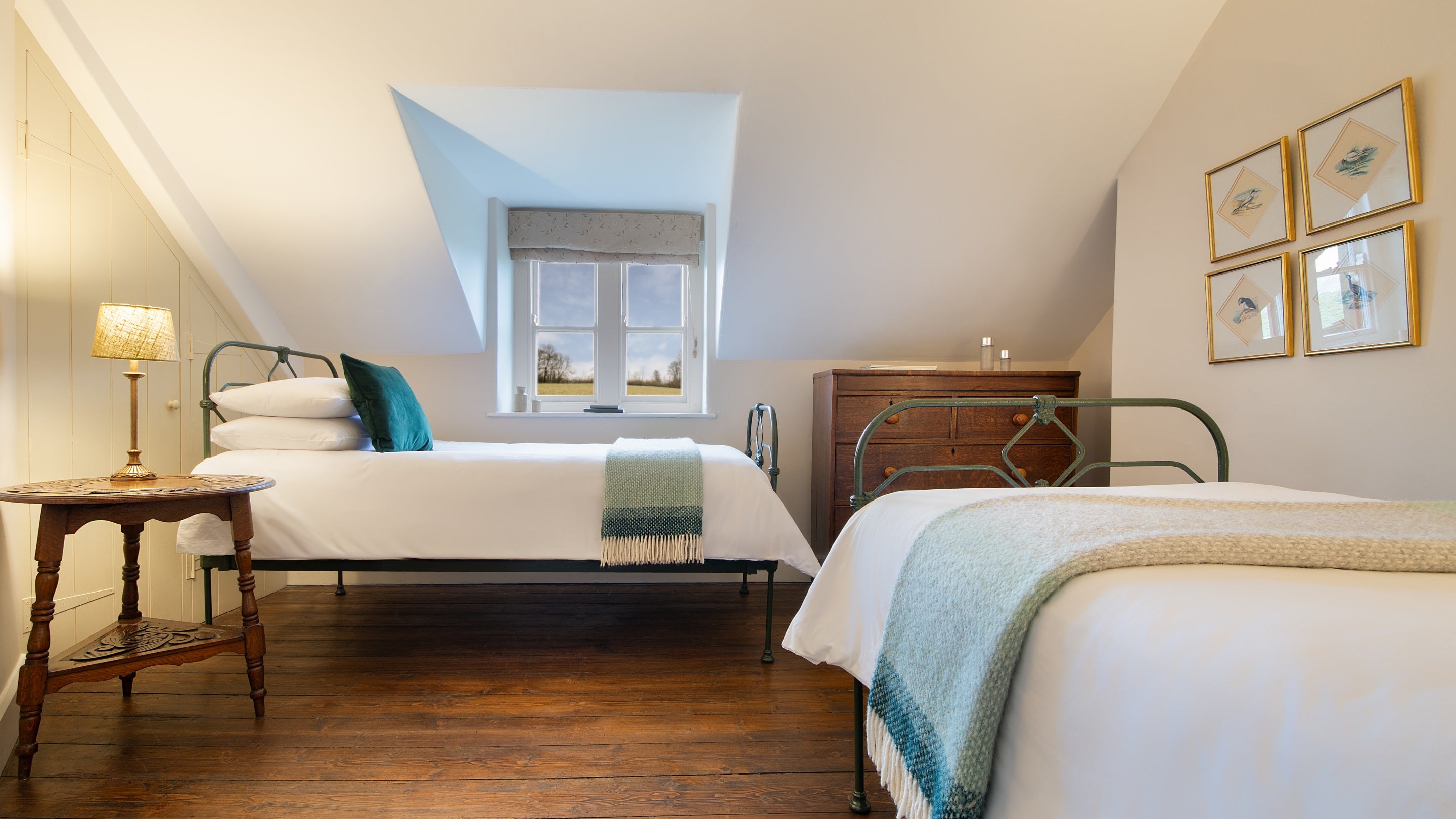 One of the twin bedrooms, with beds perpendicular to each other, at Penparc, Carmarthenshire