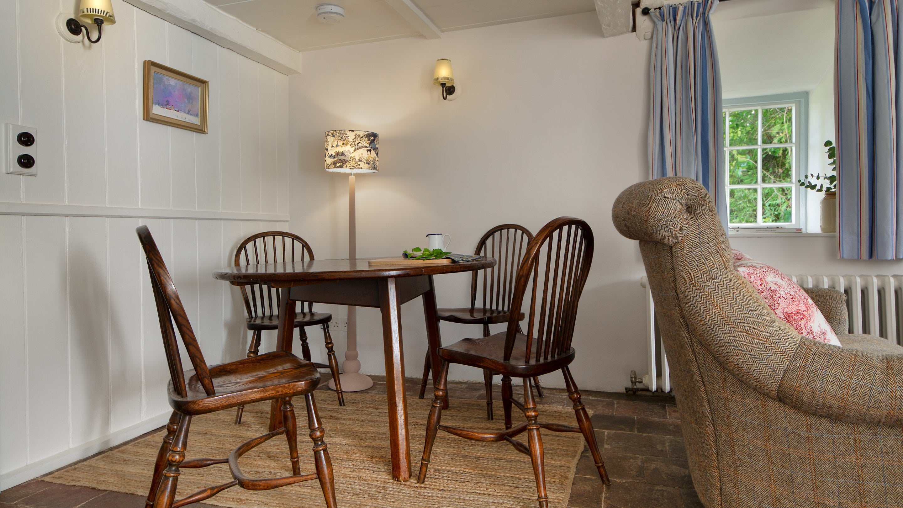 The dining table in the sitting room at Pontbrenmydyr, Ceredigion