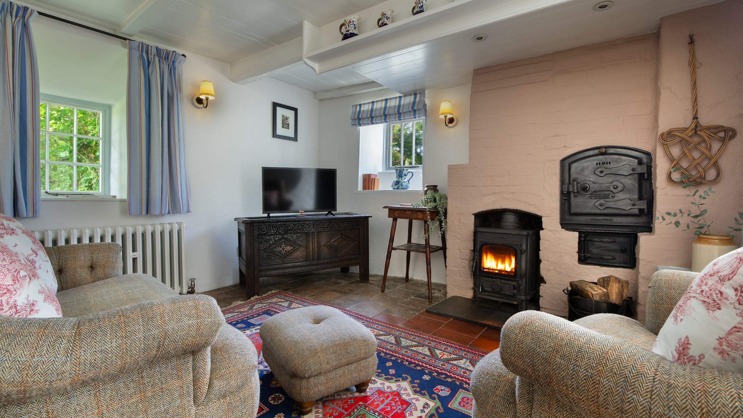 The sitting room with woodburner at Pontbrenmydyr, Ceredigion