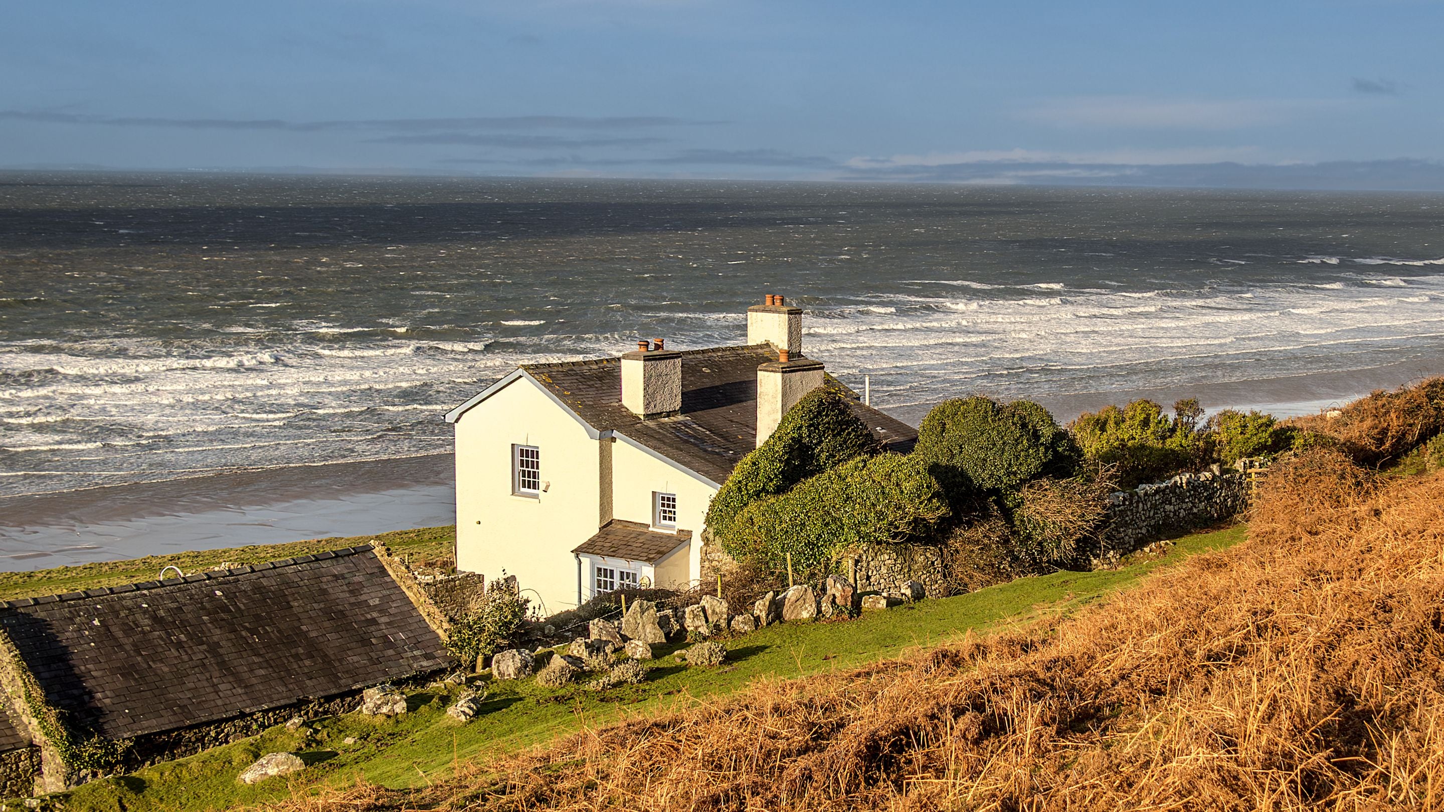 The back of Rhossili Old Rectory, overlooking the beach and sea at Rhossili Bay, South Wales