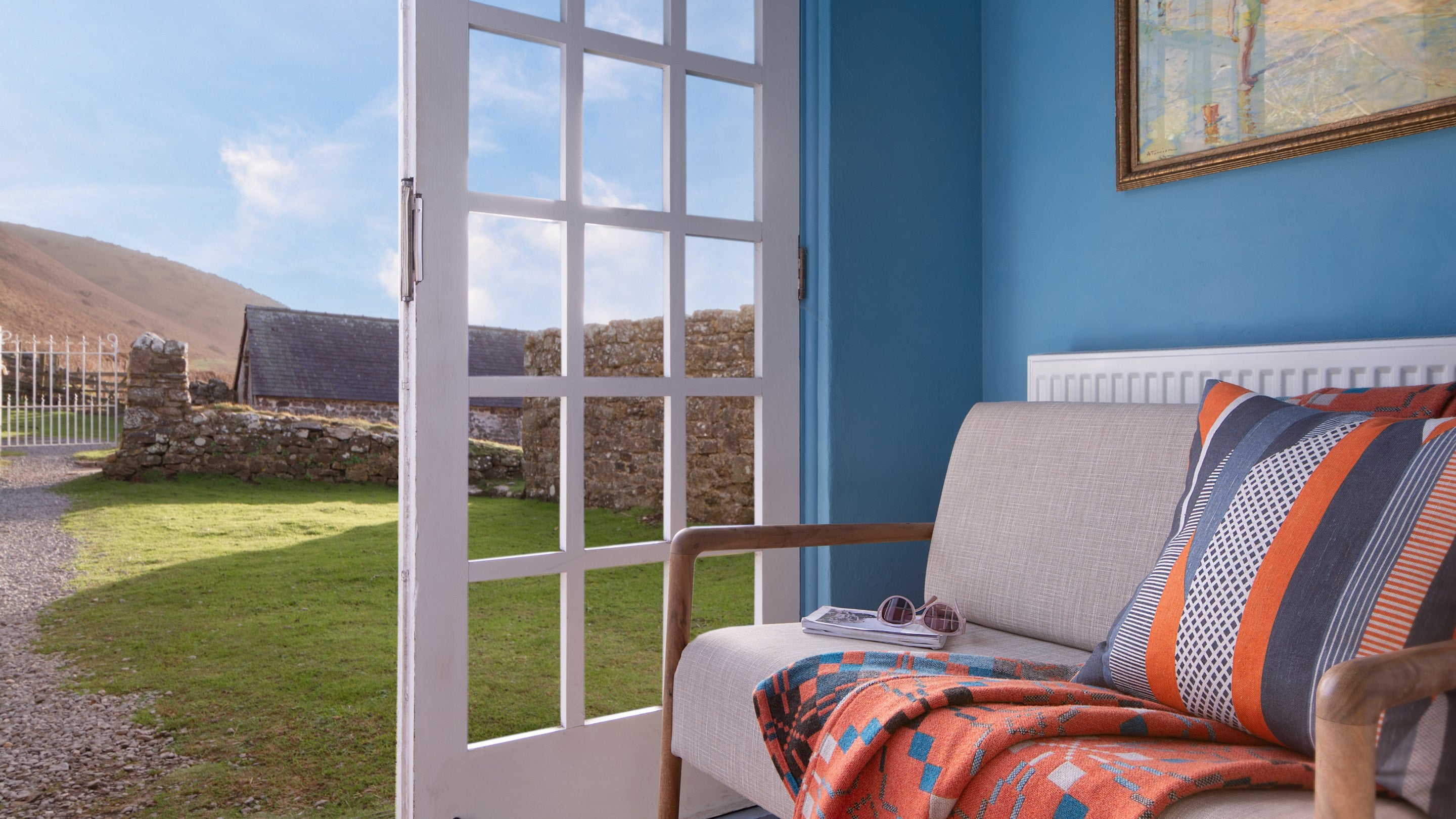 The porch with a bench, which leads to the dining room at Rhossili Old Rectory, South Wales