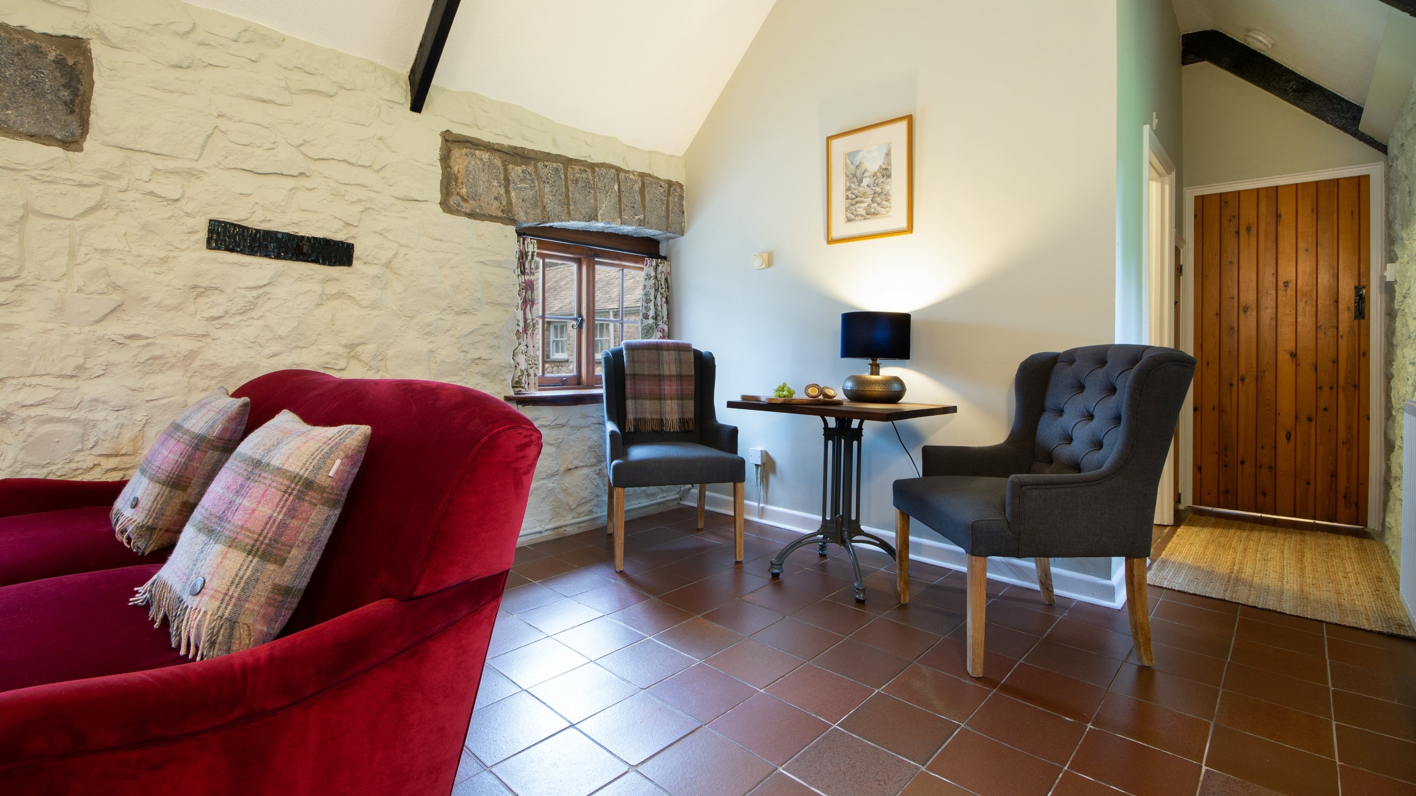 The sitting and dining room at Stackpole Byre 1, Pembrokeshire
