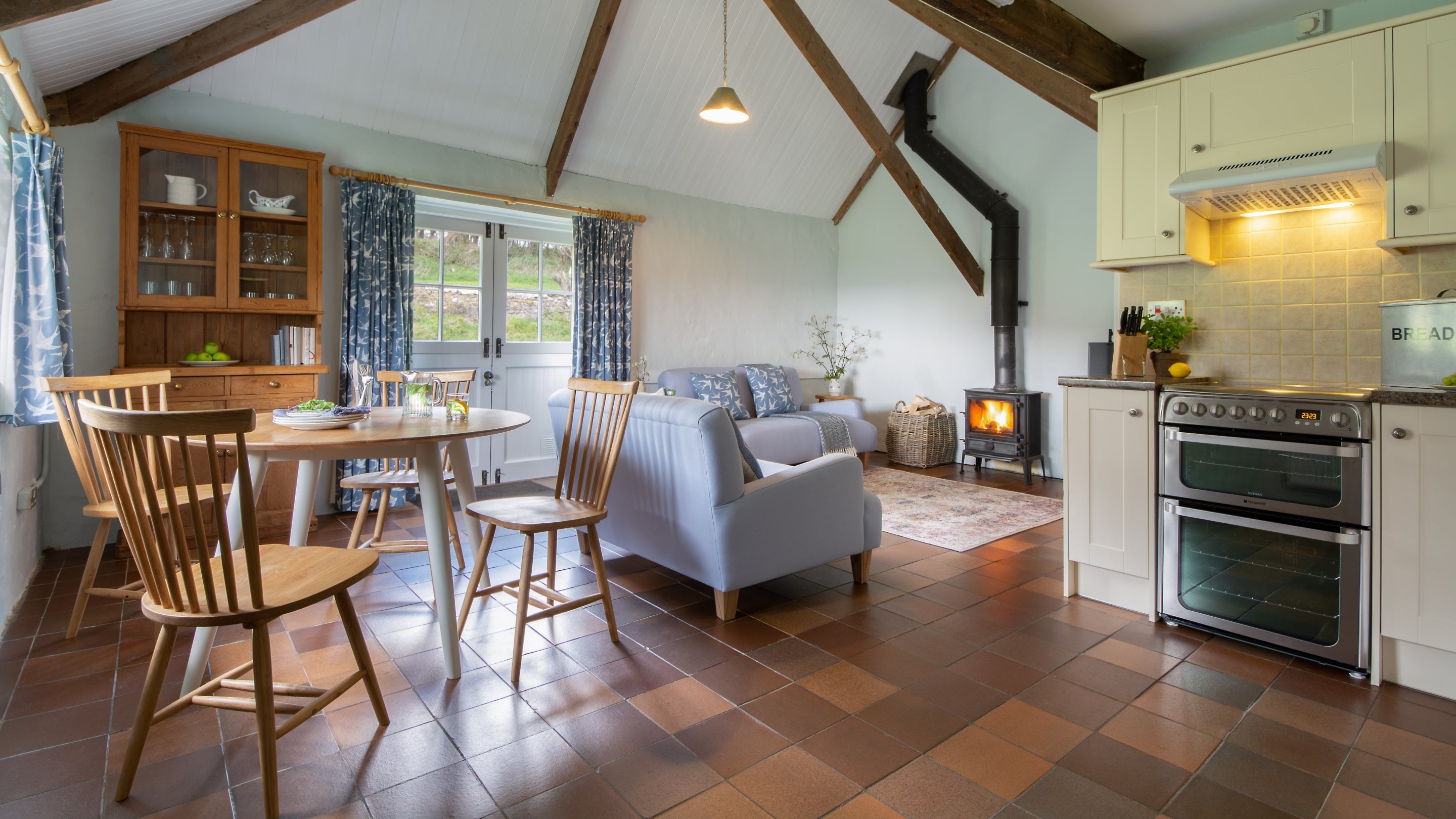 The open-plan kitchen, dining and sitting room at Stackpole Byre 2, Pembrokeshire