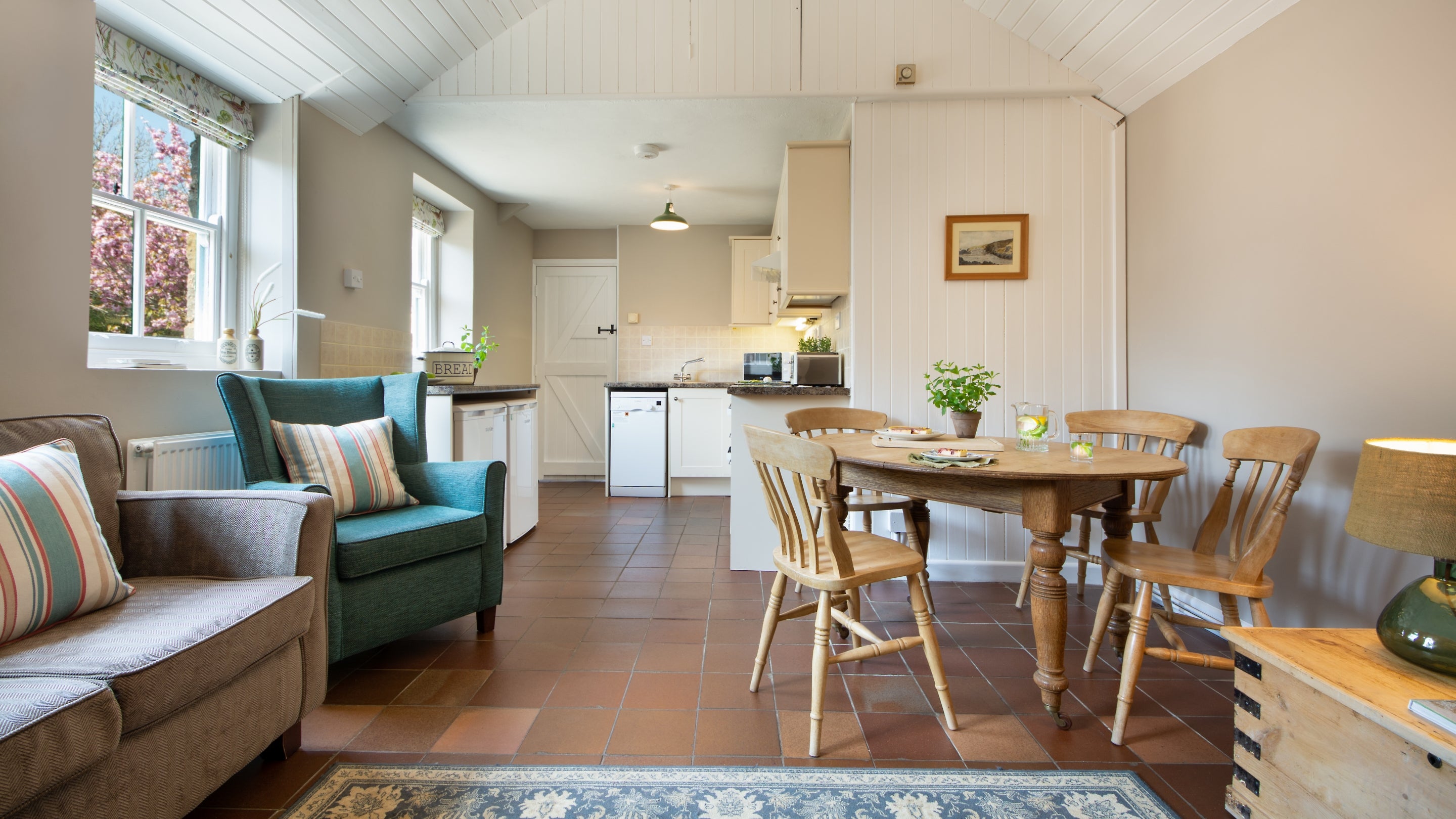 The kitchen, dining and sitting room at Stackpole Dairy Cottage, Pembrokeshire