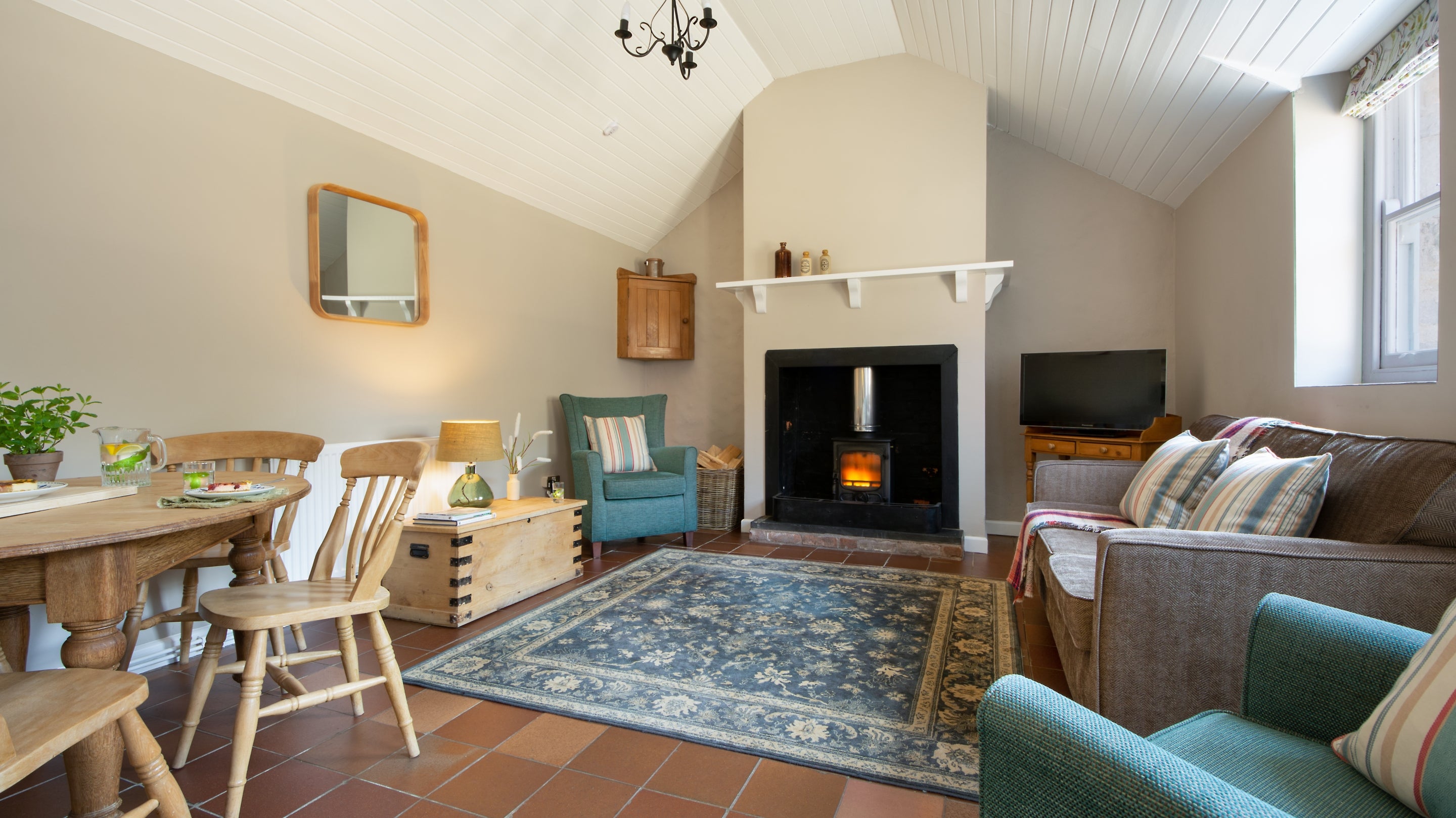 The sitting and dining room at Stackpole Dairy Cottage, Pembrokeshire