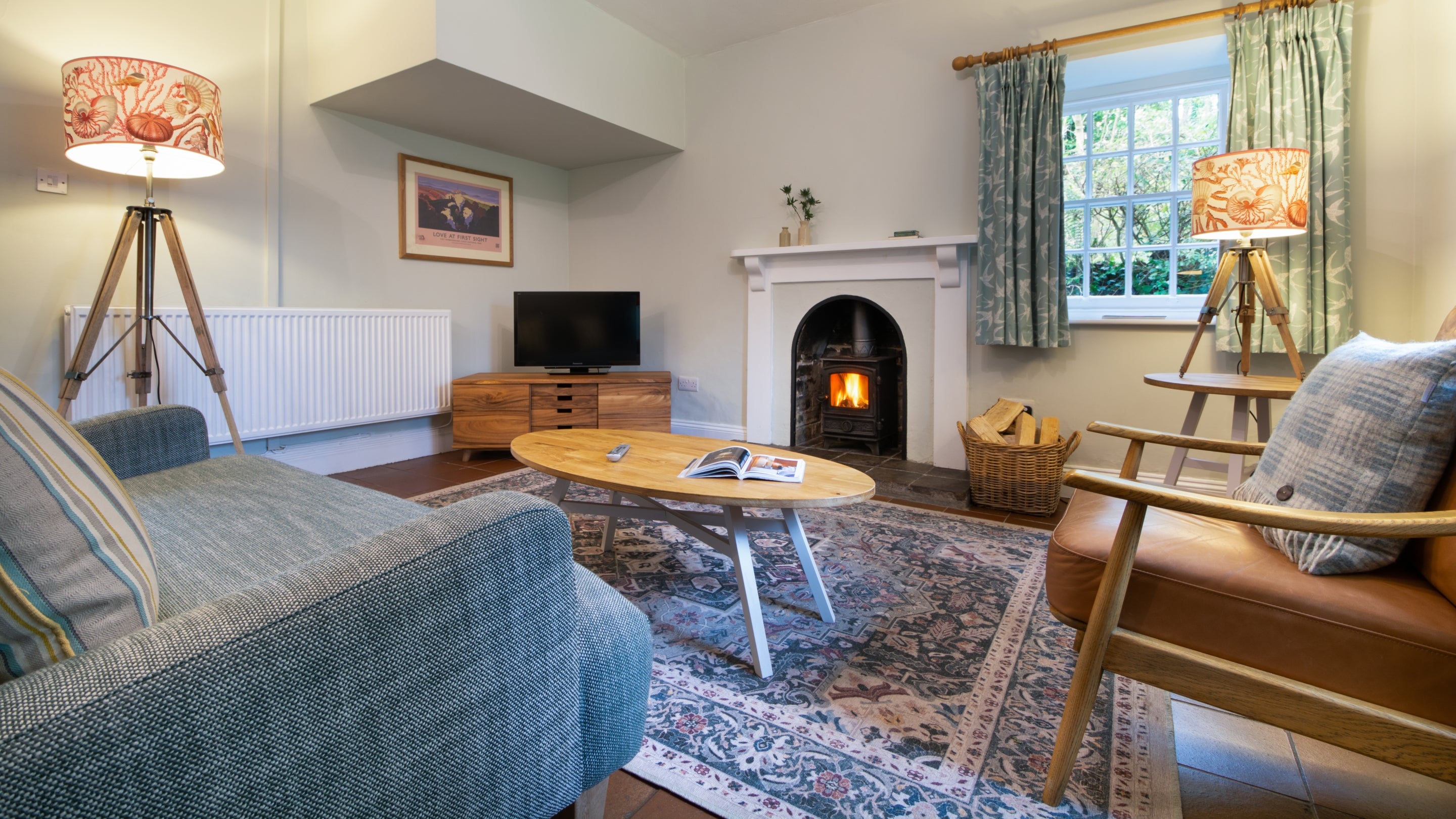 The sitting and dining room at Stackpole Quay Cottage 1, Pembrokeshire
