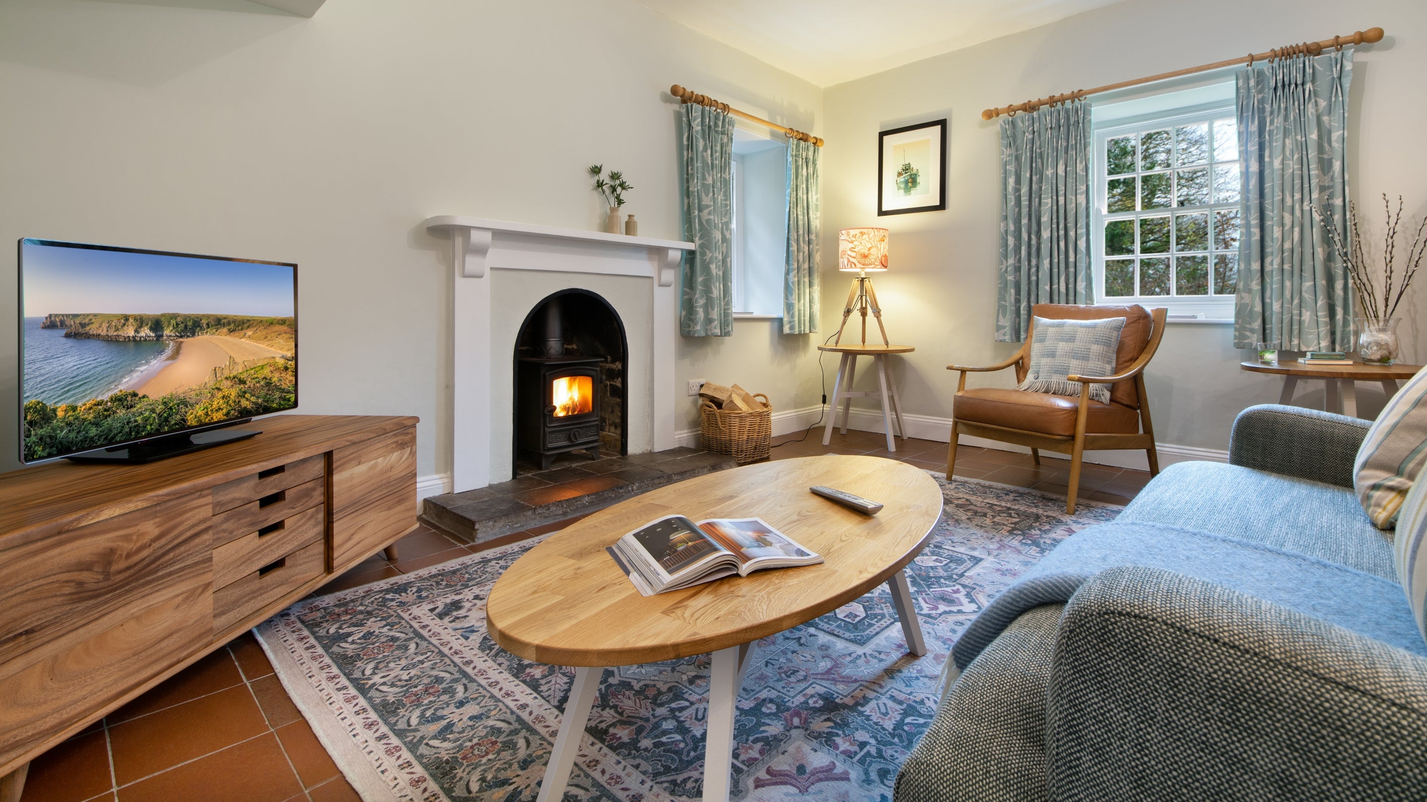 The sitting and dining room at Stackpole Quay Cottage 1, Pembrokeshire