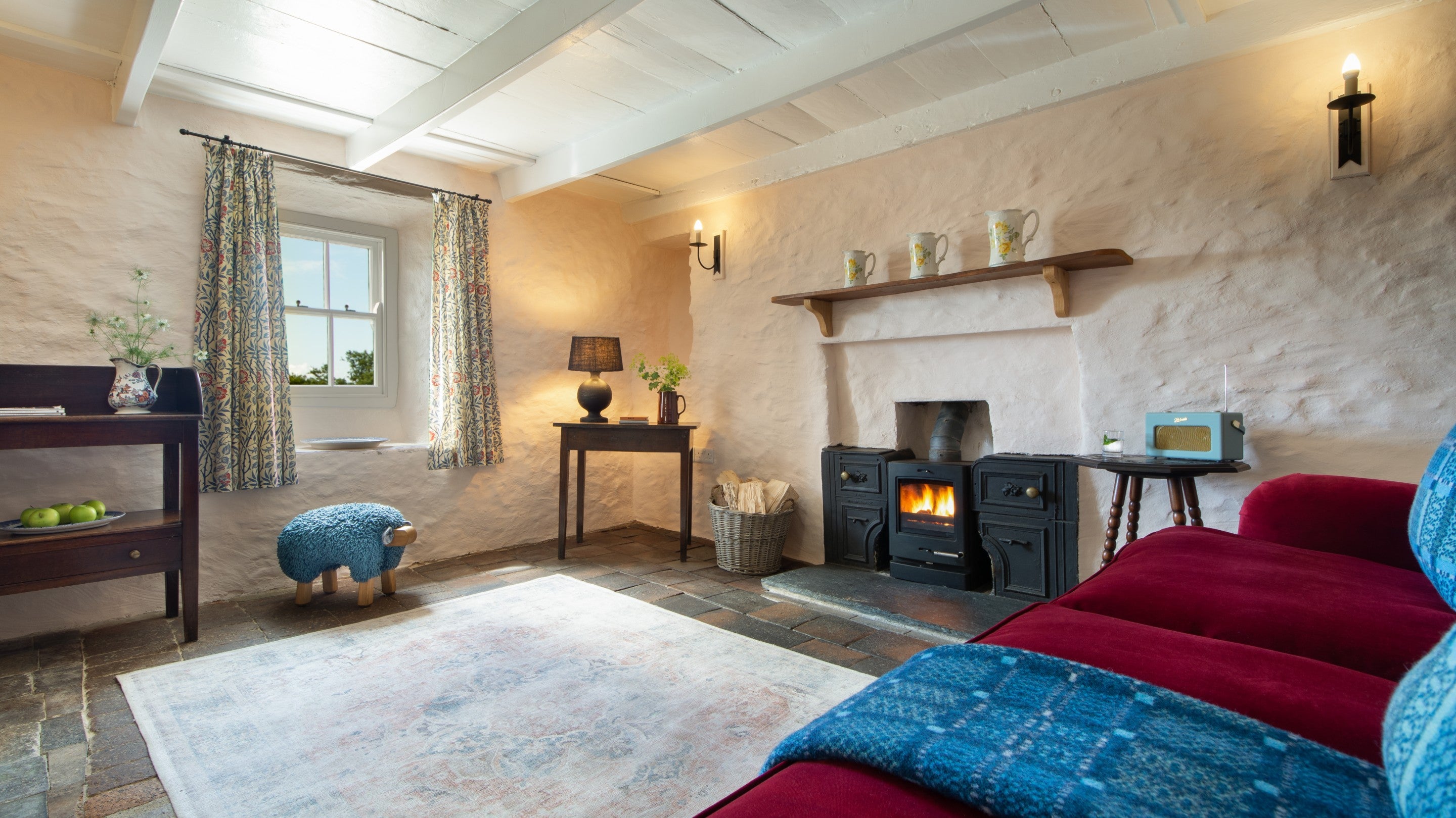 The sitting room with woodburner at Treleddyd Fawr Cottage, Pembrokeshire