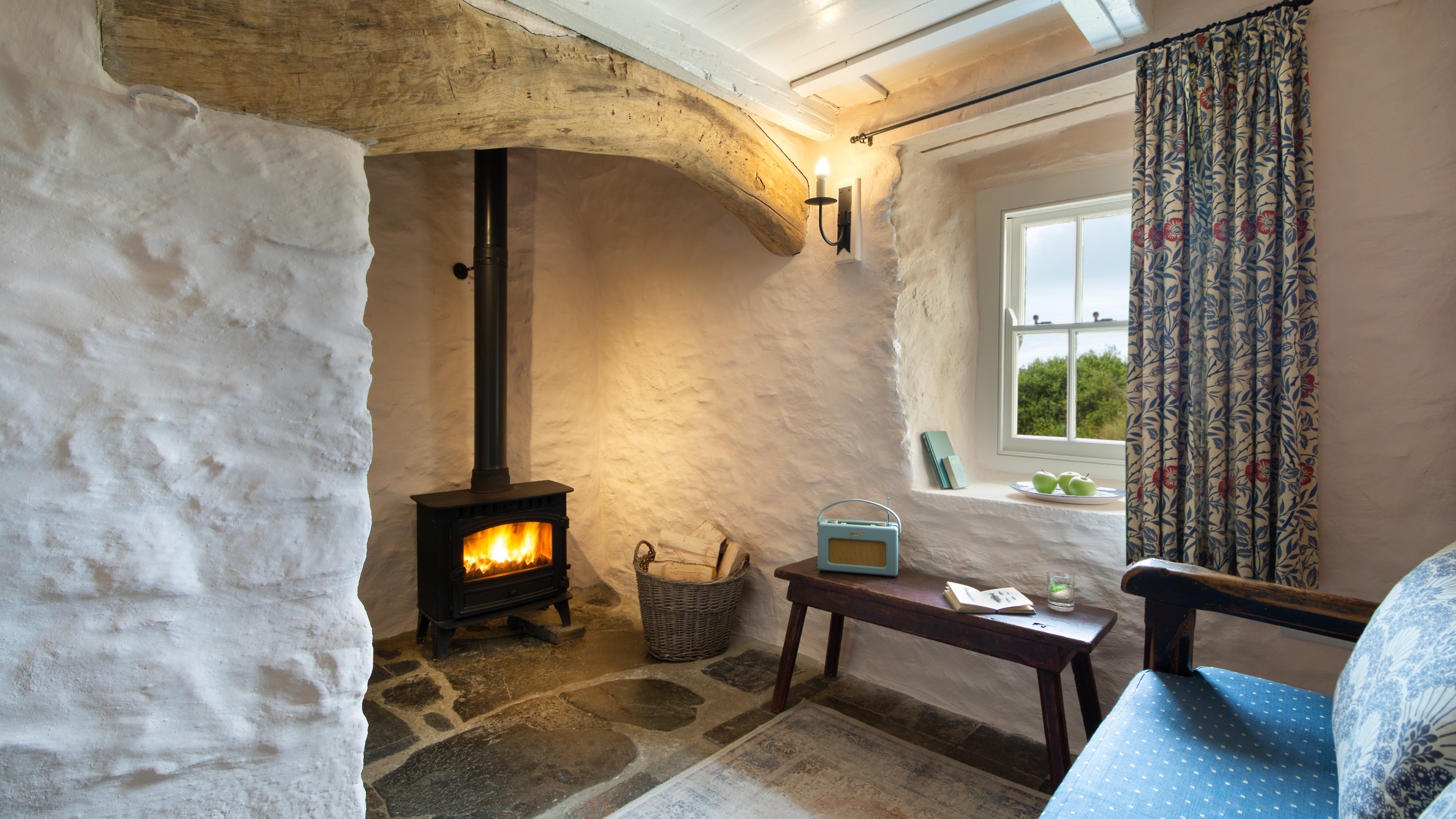 The woodburner in the parlour at Treleddyd Fawr Cottage, Pembrokeshire