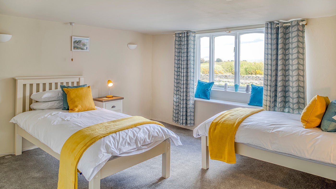 The first twin bedroom at Ty'n y Parc Barn, Gwynedd, Wales