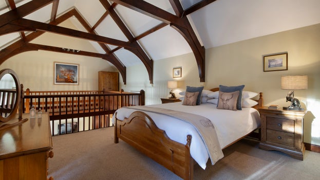 The open gallery bedroom with double bed at Abbey Stores, North Yorkshire