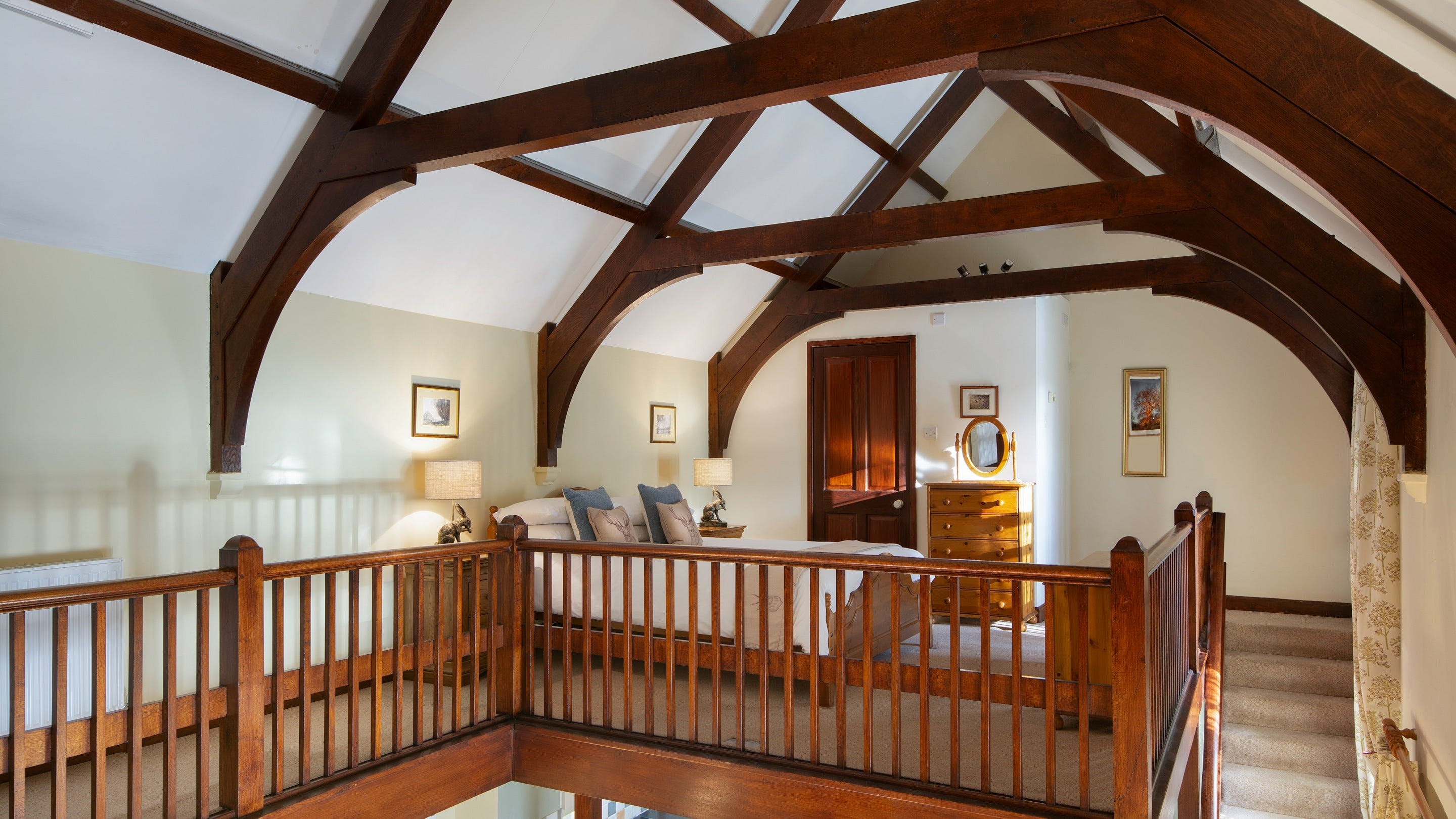 The double bedroom with beamed, vaulted ceiling at Abbey Stores, North Yorkshire