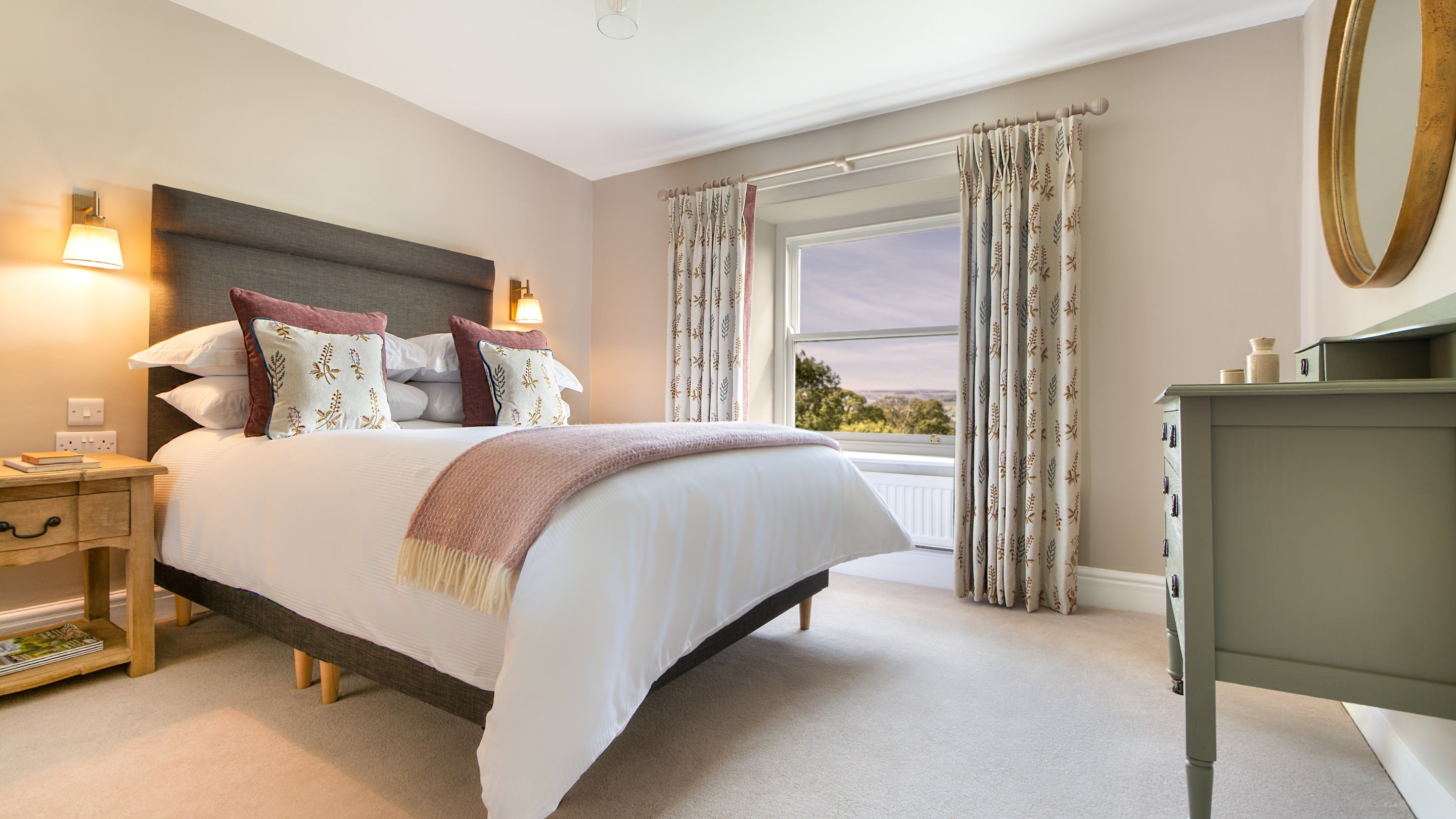 The double bedroom at Druid's Cave Farmhouse, with views of the Yorkshire Dales, North Yorkshire