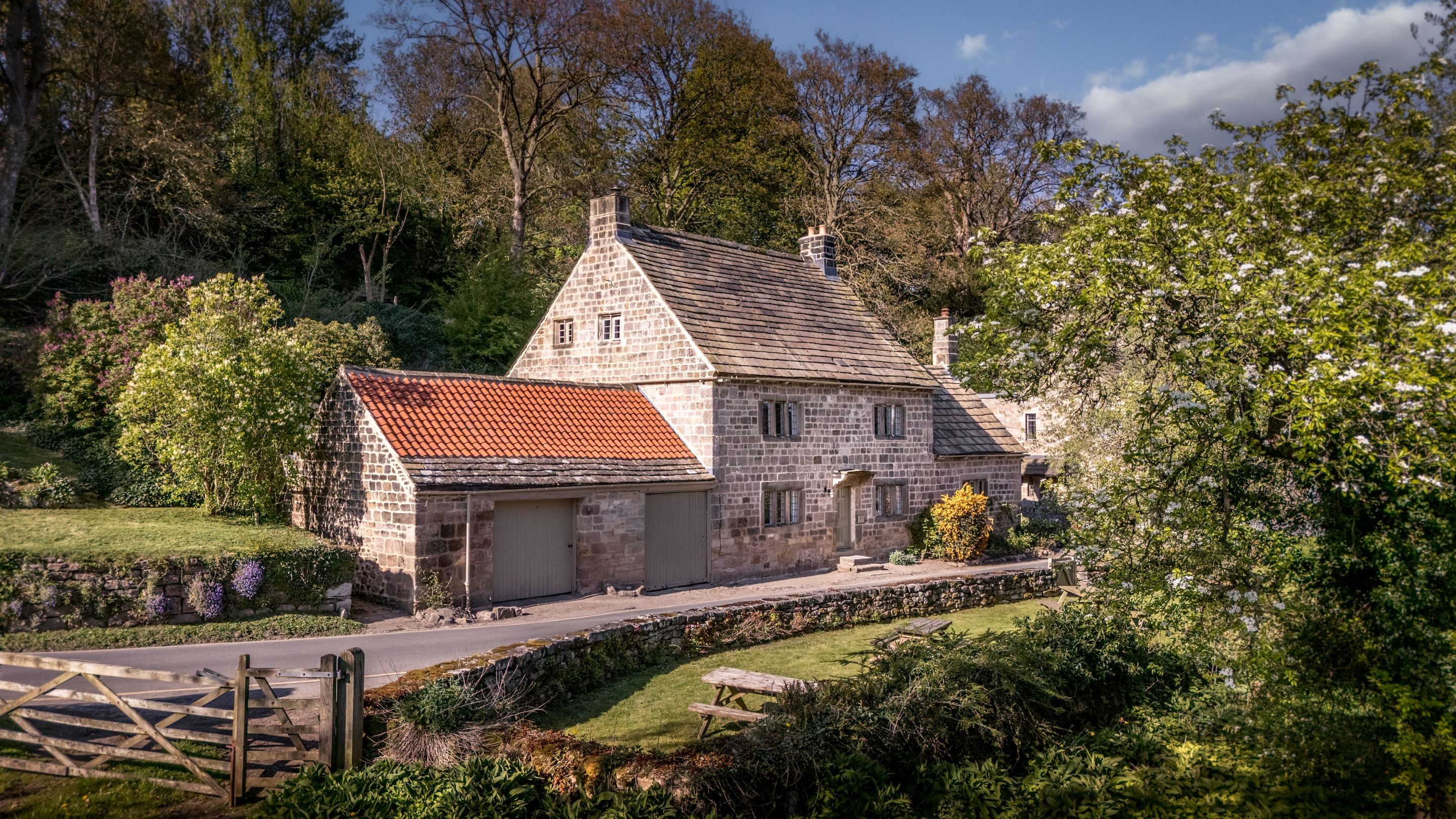 An aerial view of Fountains Cottage and the road passing next to it, Yorkshire