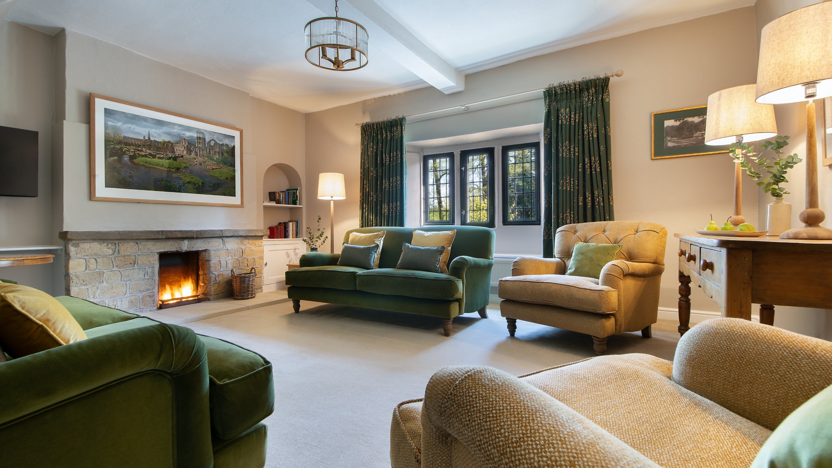 The sitting room with open fire at Fountains Cottage, Yorkshire
