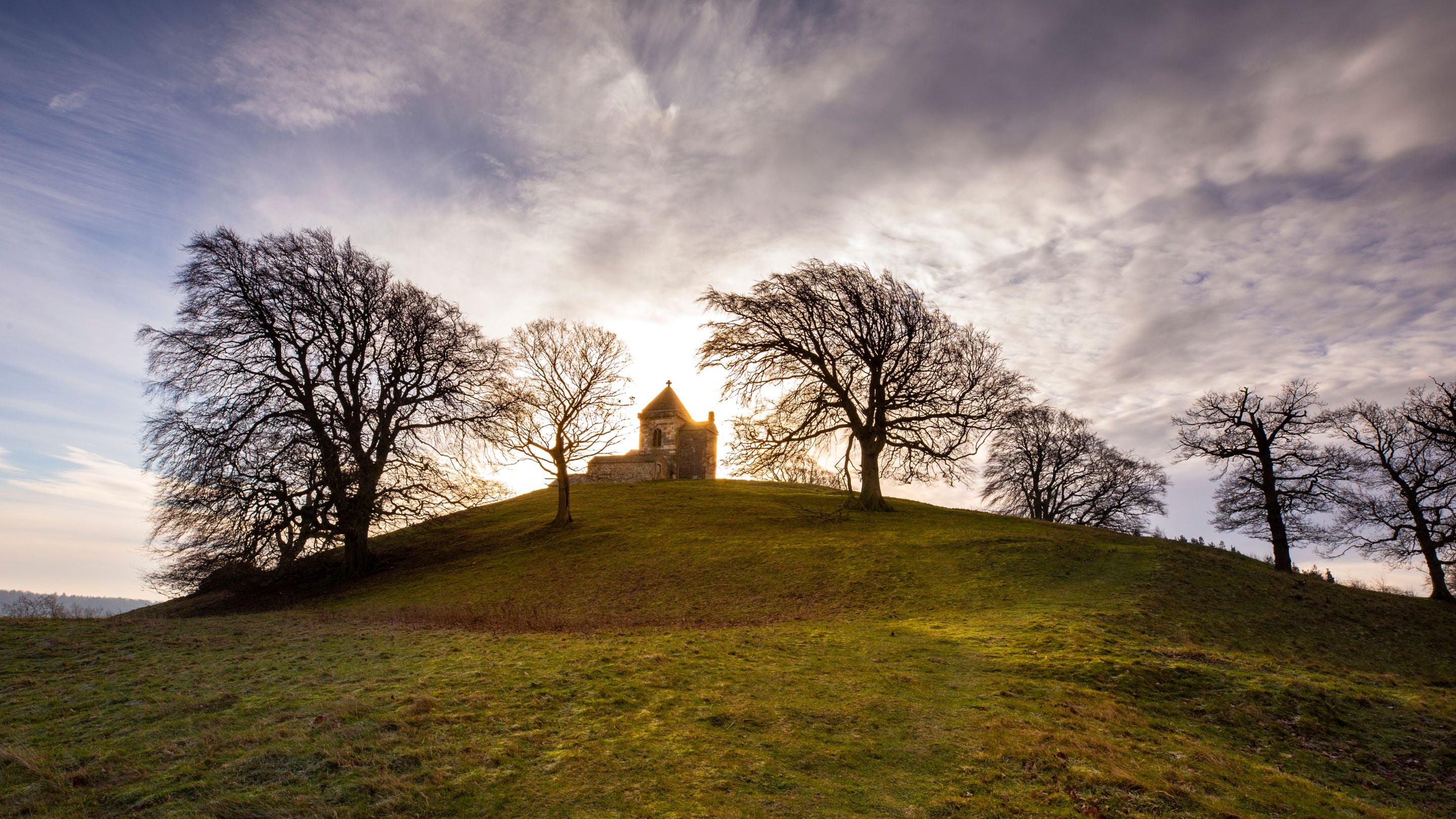 How Hill, a steep hill with a tower at the top, behind the How Hill cottages, Yorkshire