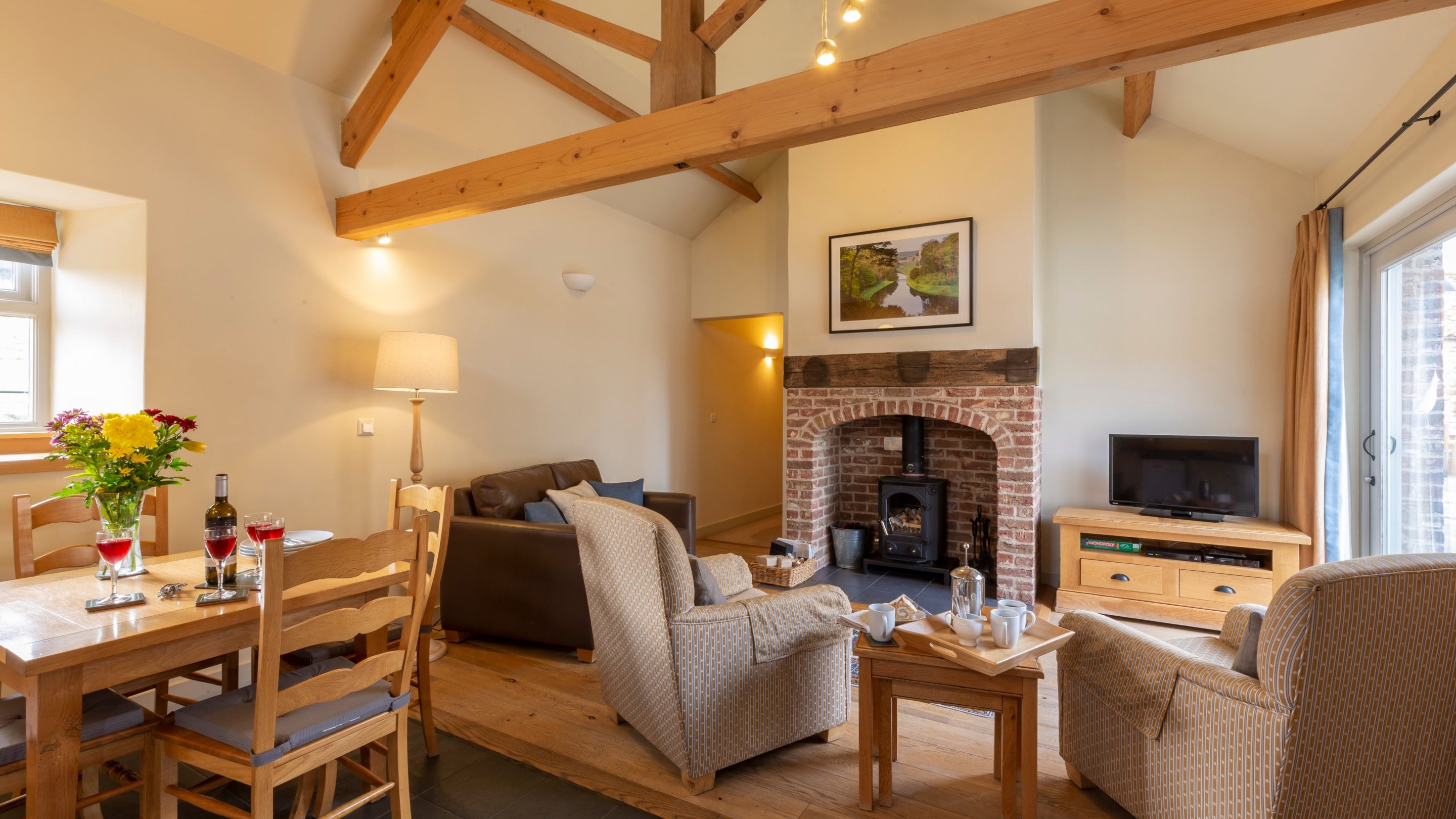 The open-plan kitchen, dining and sitting room with woodburner at Lark, Yorkshire